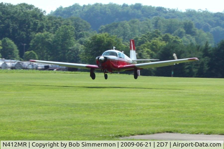 N412MR, 1968 Mooney M20C Ranger C/N 680163, Landing on 28 at the Beach City, Ohio Father's Day fly-in.