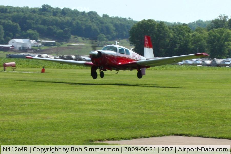 N412MR, 1968 Mooney M20C Ranger C/N 680163, Landing on 28 at the Beach City, Ohio Father's Day fly-in.