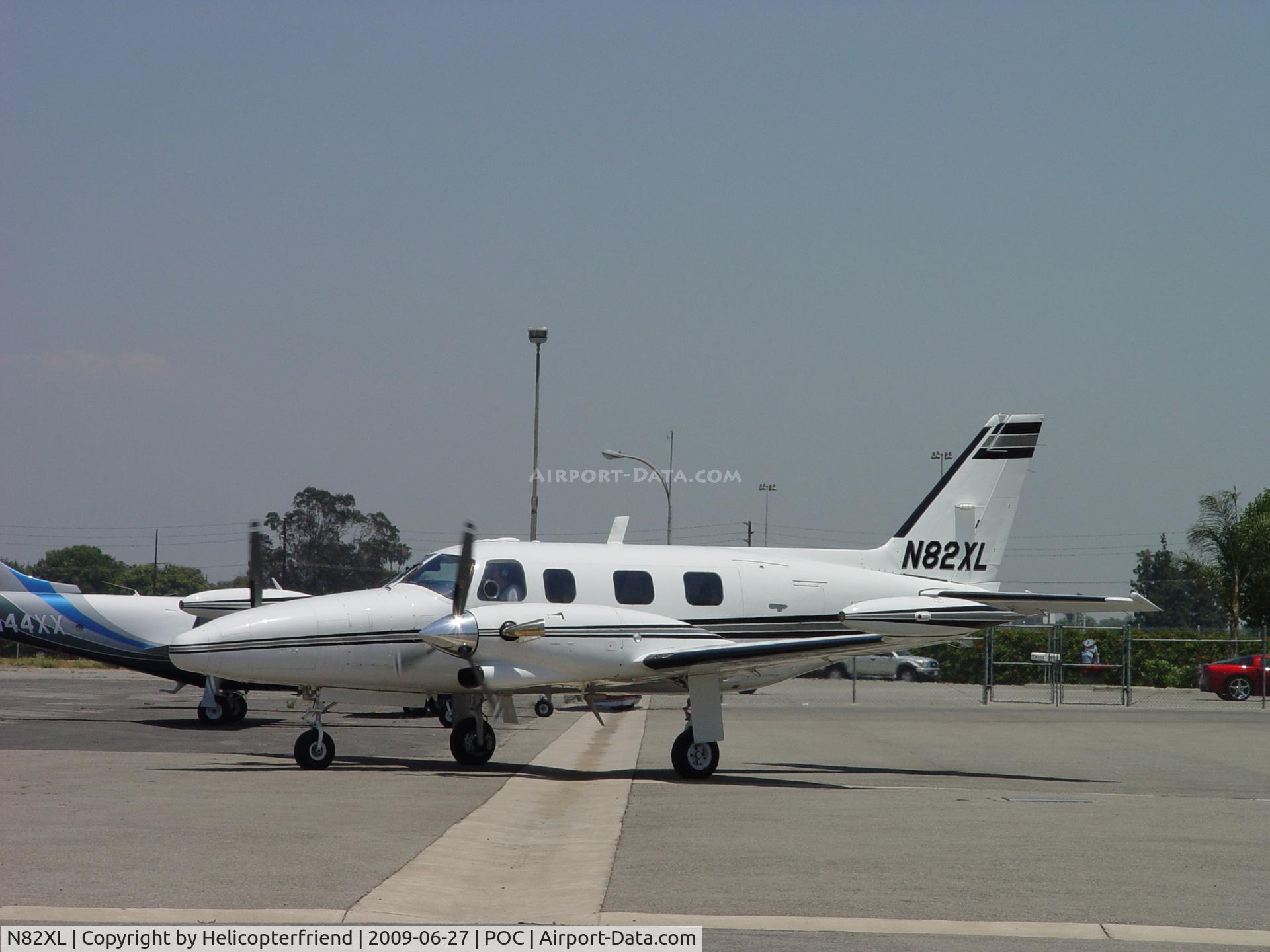 N82XL, 1981 Piper PA-31T2 Cheyenne IIXL C/N 31T-8166034, Taxiing past N44XX enroute to runway 26L
