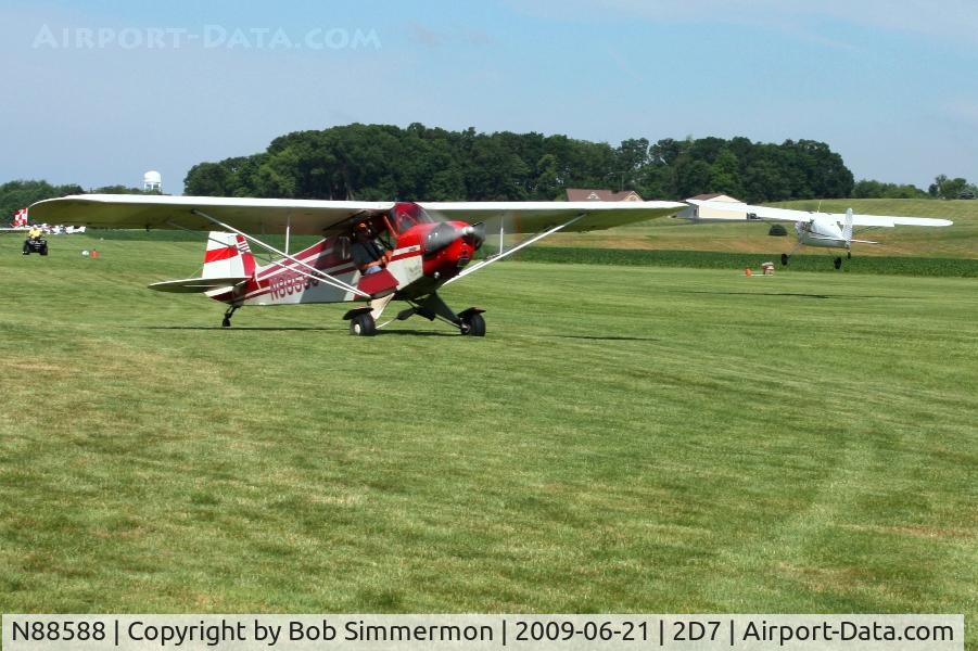 N88588, 1946 Piper J3C-65 Cub Cub C/N 16214, Father's Day fly-in at Beach City, Ohio. N2774N landing in the background.