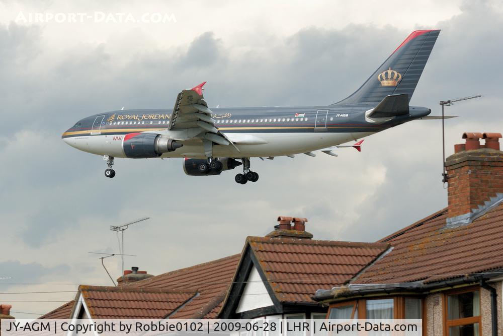 JY-AGM, 1989 Airbus A310-304 C/N 491, over the houses