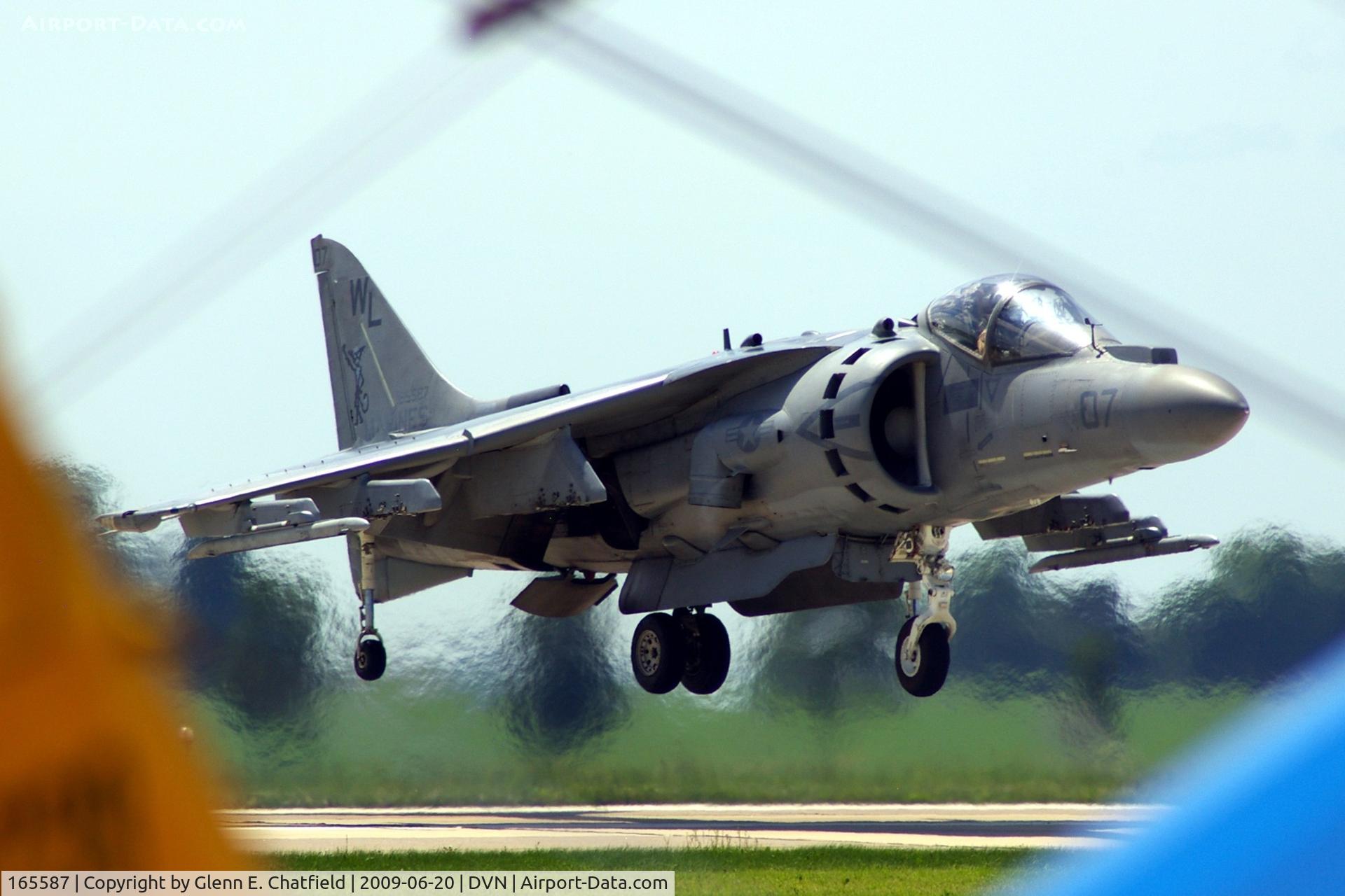165587, Boeing AV-8B+(R)-27-MC Harrier II Plus C/N B324, Quad Cities Air Show; looking over the tail and between the wings of a PT-17 as the AV-8B lifts off