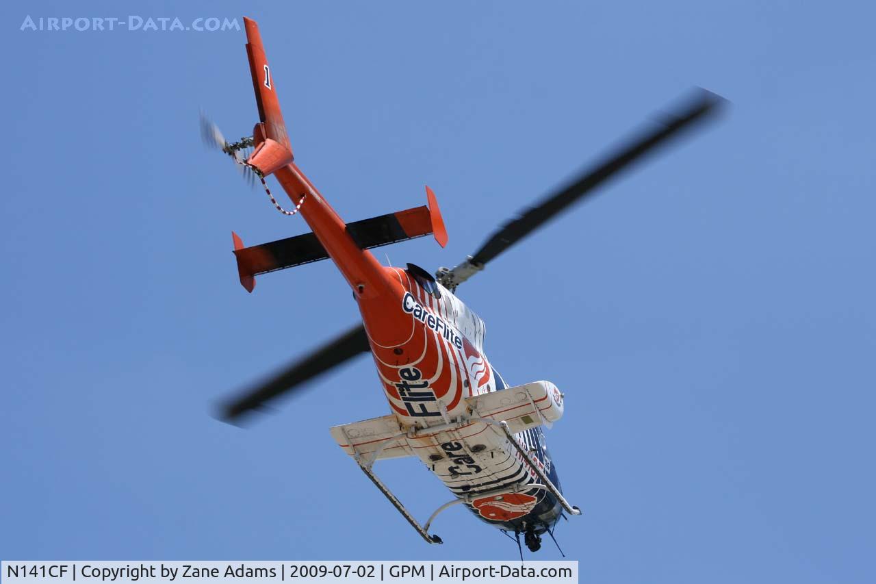 N141CF, 1984 Bell 222U C/N 47524, Care Flite landing at Grand Prairie Municipal