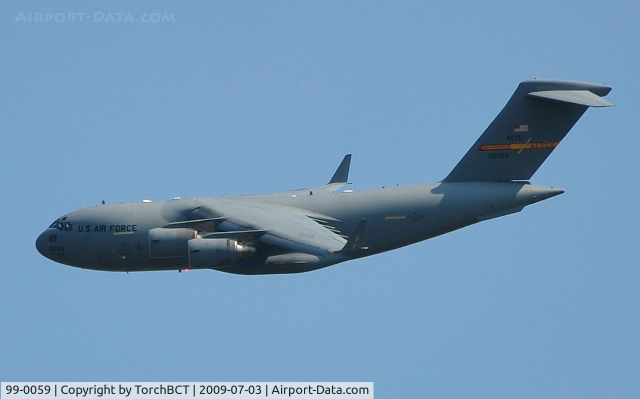 99-0059, 1999 Boeing C-17A Globemaster III C/N 50063/P-59, 58th Airlift Squadron Globemaster flying low over the Cedar Creek Lake area.