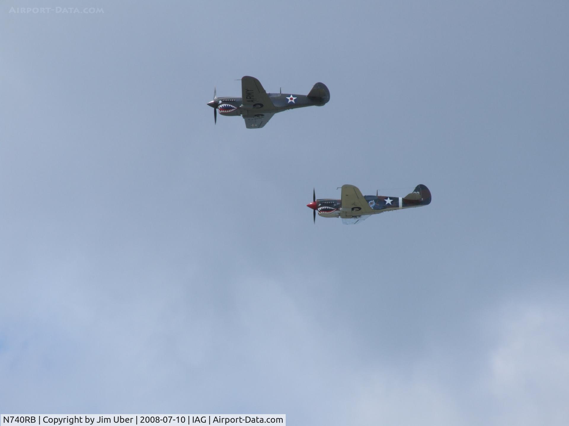 N740RB, 1944 Curtiss P-40N Warhawk C/N 33108, along with NX1232N, beating up the field during a museum charity event, celebrating Buffalo-Built planes