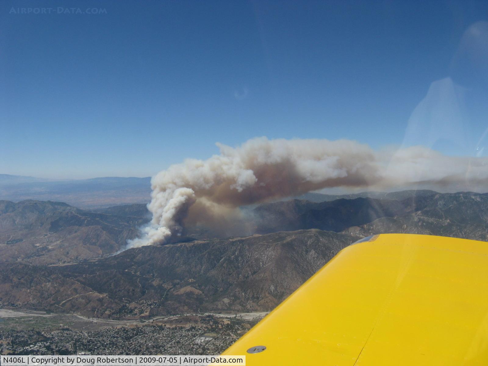 N406L, 2008 Vans RV-6 C/N 936, New Forest Fire in San Gabriel Mountains above La Crescenta in Angeles National Forest seen from N406L. Aerial tanker (firebomber) enroute reporting 40 miles away.