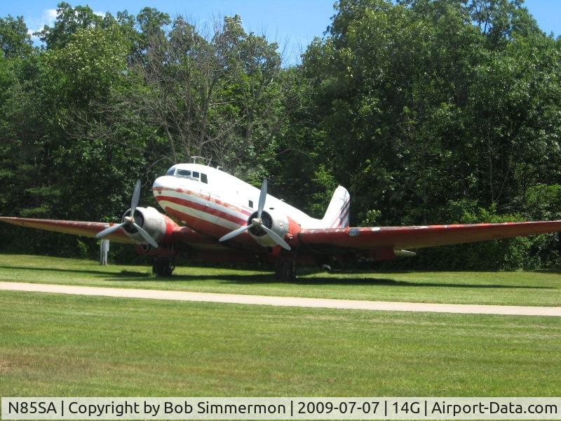 N85SA, 1943 Douglas DC3A C/N 11637, Parked in the grass at Fremont, Ohio.