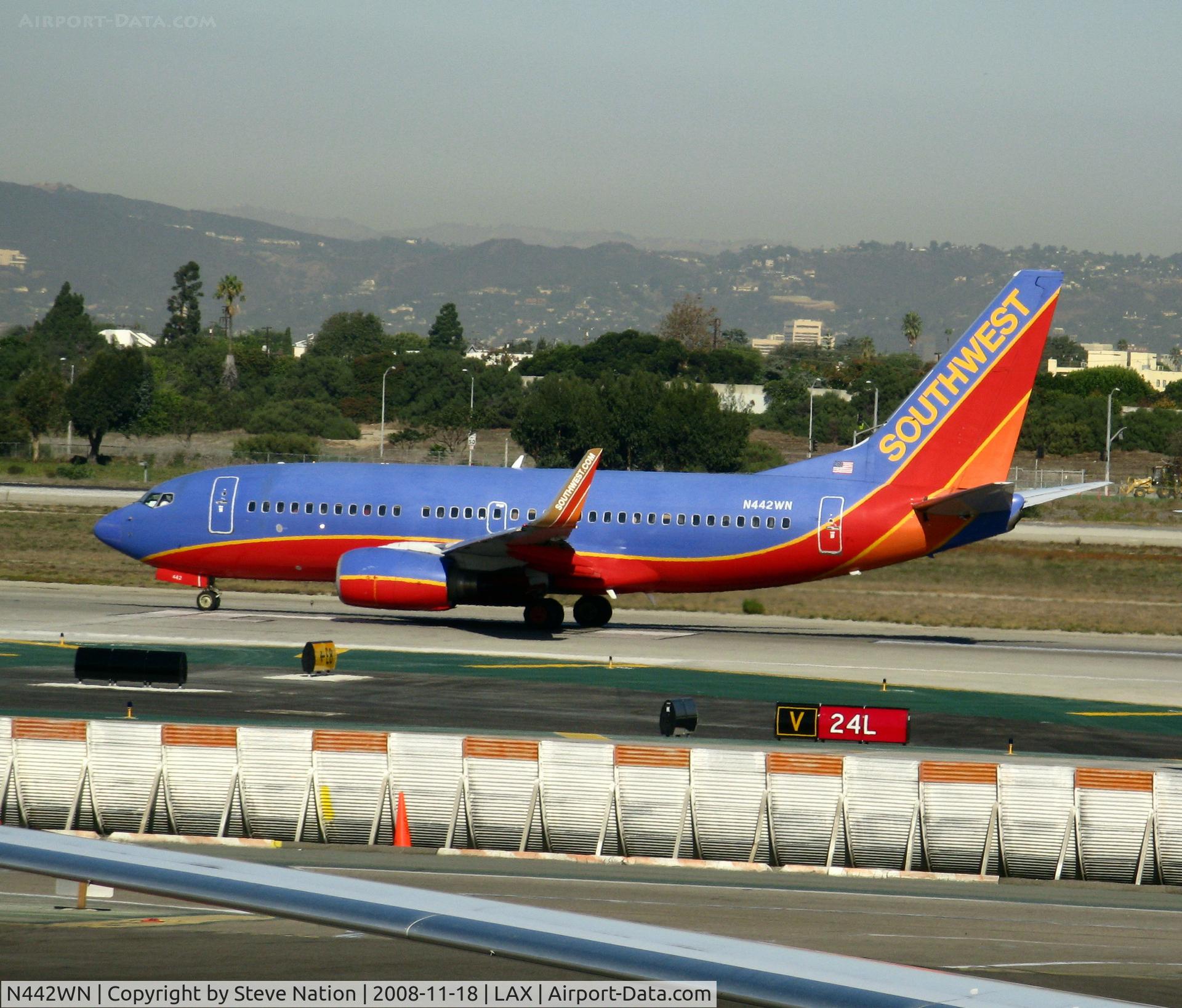 N442WN, 2003 Boeing 737-7H4 C/N 32459, Southwest 2003 Boeing 737-7H4 in new colors w/winglets rolling on Runway 24L