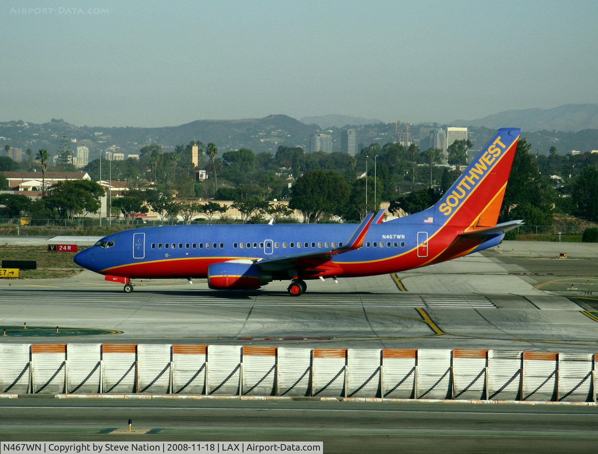 N467WN, 2004 Boeing 737-7H4 C/N 33830, Southwest 2004 Boeing 737-7H4 in new colors w/winglets lined up for TO on Runway 24L