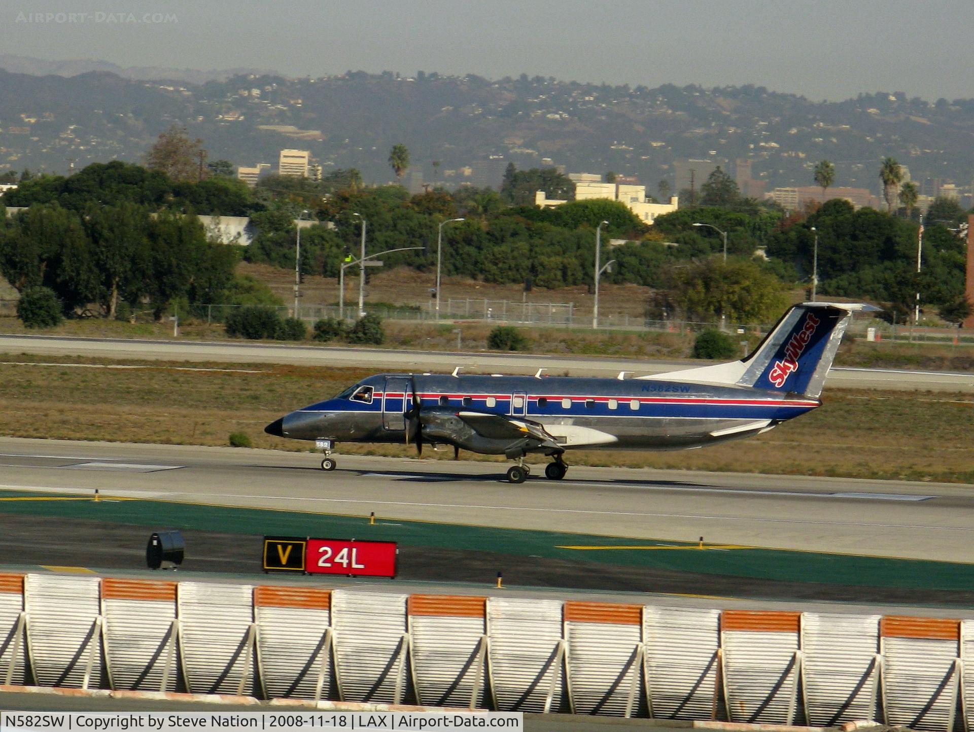 N582SW, 1999 Embraer EMB-120ER Brasilia C/N 120350, Sky west 1999 EMB-120R rolling on RW 24L