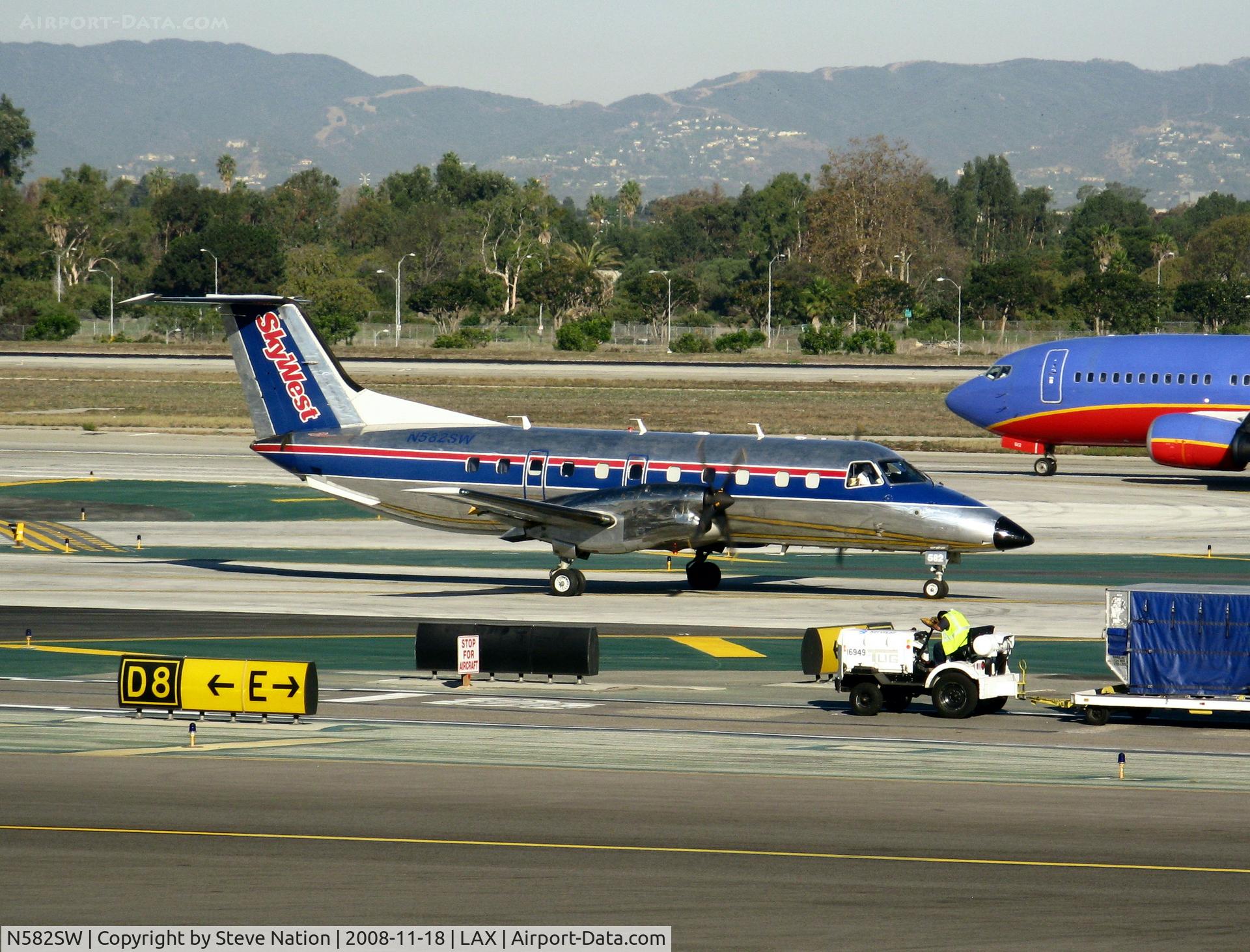 N582SW, 1999 Embraer EMB-120ER Brasilia C/N 120350, Sky west 1999 EMB-120R taxiing to RW 24L