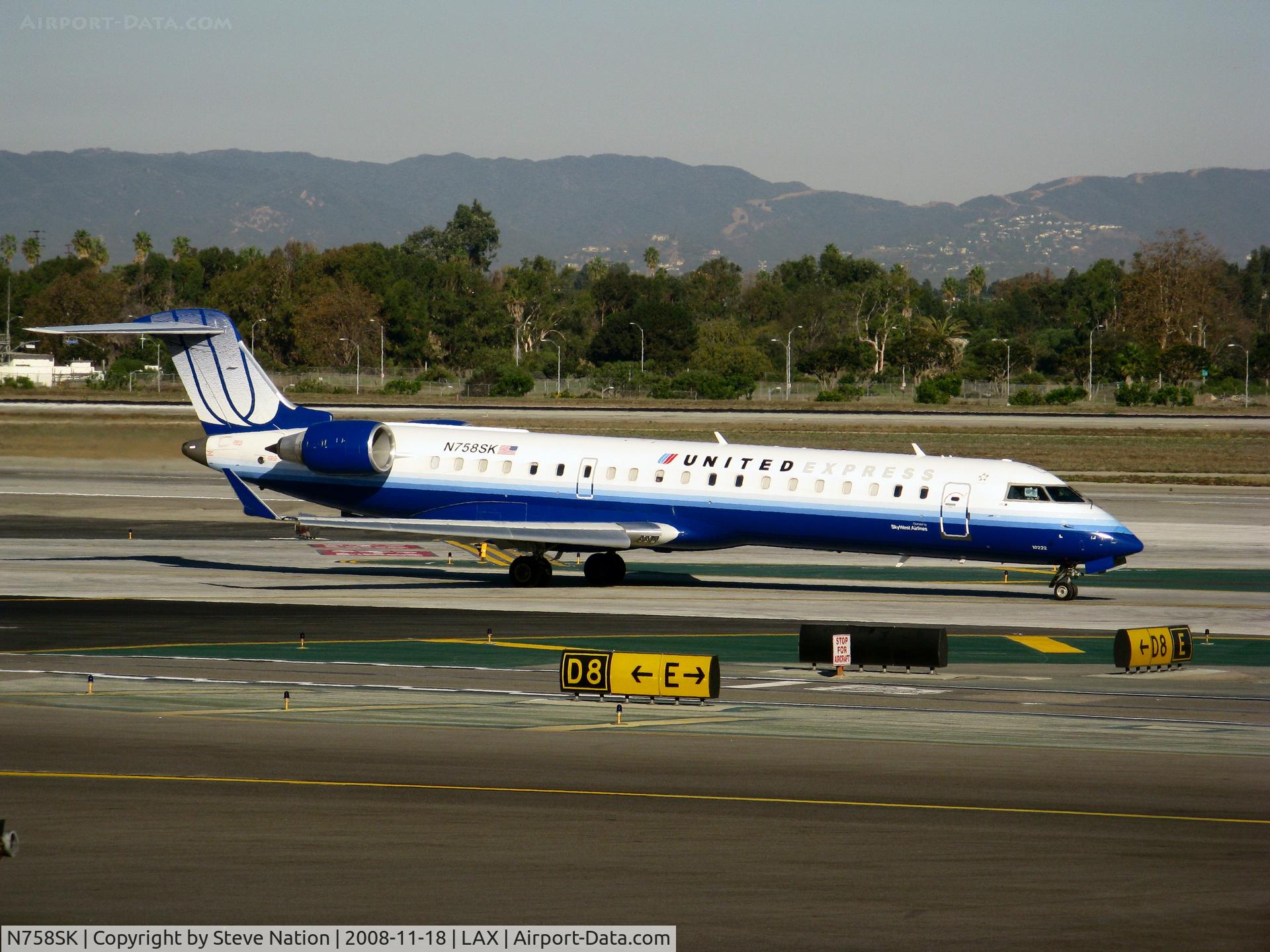 N758SK, 2005 Bombardier CRJ-701ER (CL-600-2C10) Regional Jet C/N 10222, United Express 2005 Bombardier CL-600-2C10 in latest colors (small Sky West Airlines titles) taxiing to RW 24L