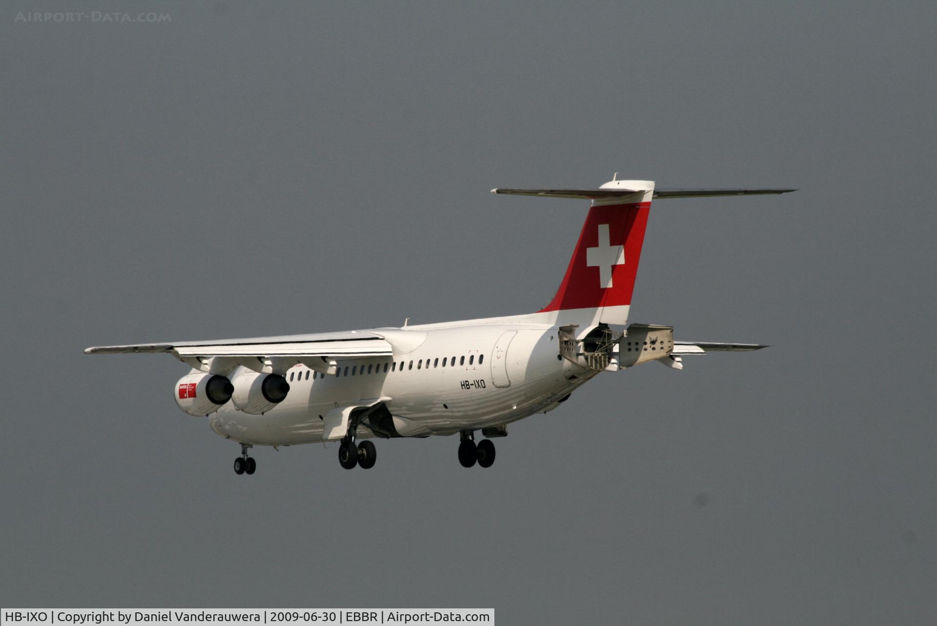 HB-IXO, 1996 British Aerospace Avro 146-RJ100 C/N E3284, flight LX778 is descending to rwy 25L