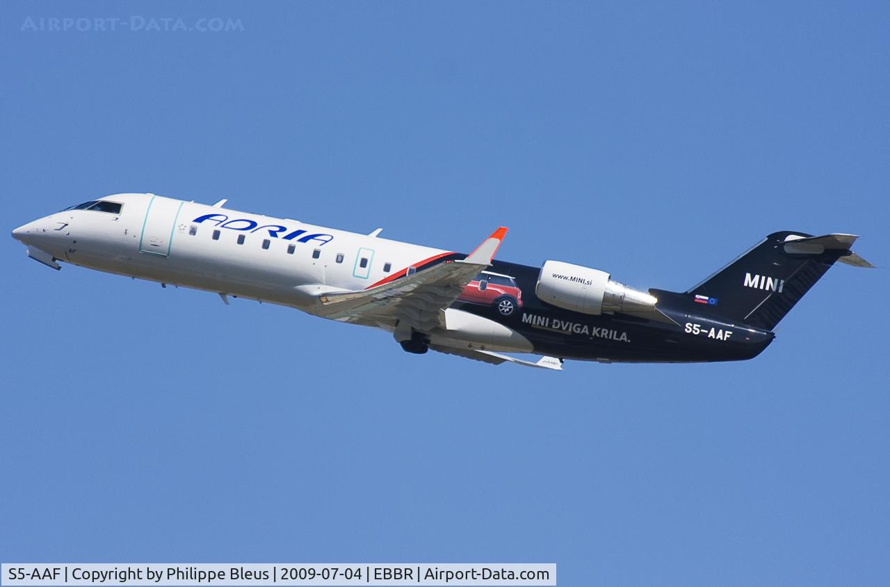 S5-AAF, 1998 Canadair CRJ-200LR (CL-600-2B19) C/N 7272, Special Mini scheme for this CRJ climbing from rwy 25R.