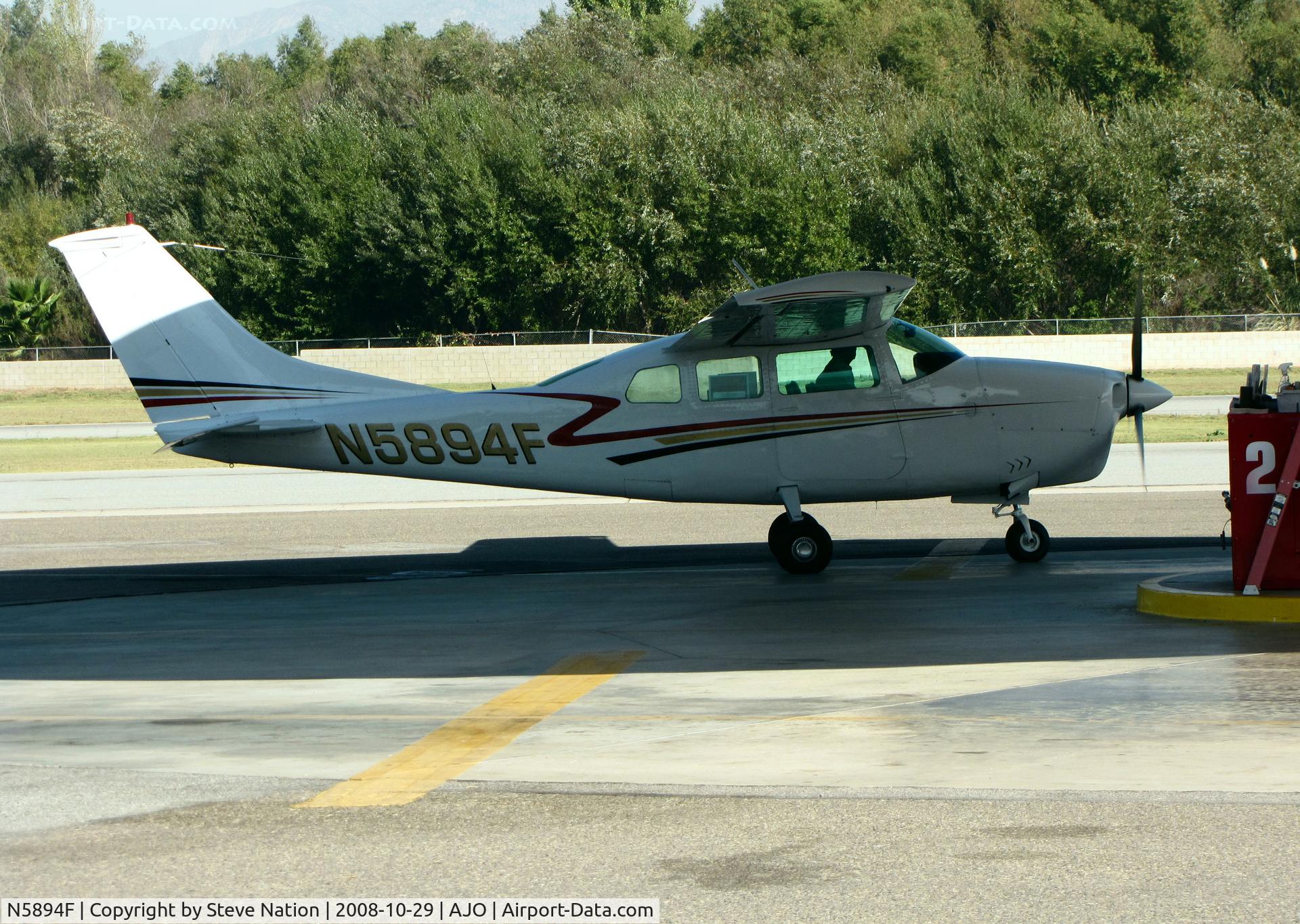 N5894F, 1967 Cessna 210G Centurion C/N 21058894, 1967 Cessna 210G pulling up to gas pumps @ 