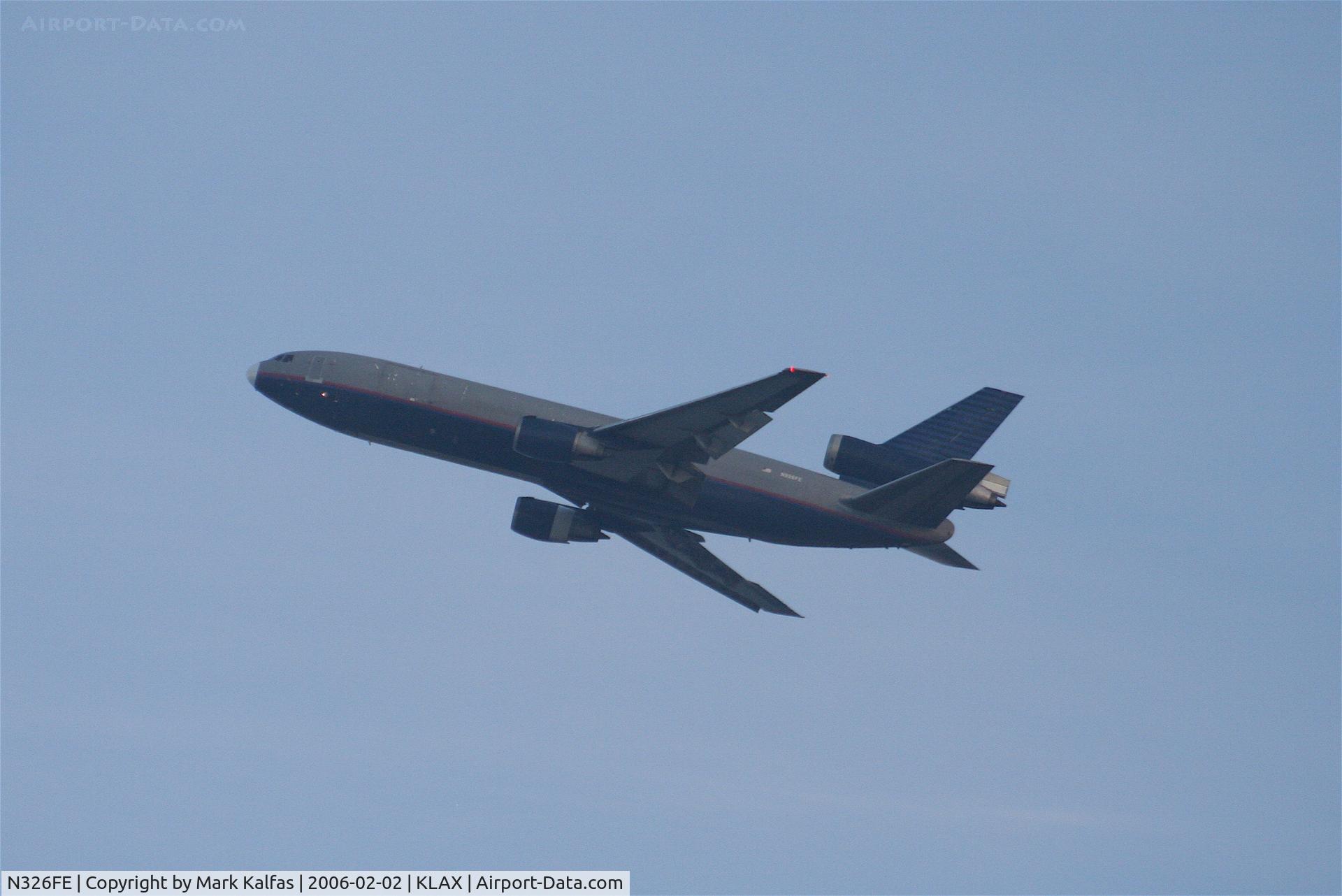 N326FE, 1984 McDonnell Douglas DC-10-30 C/N 47813, Fed Ex, N326FE, DC-10-30 (ex-United Airlines N1854U) ghost plane, departs 25L KLAX.