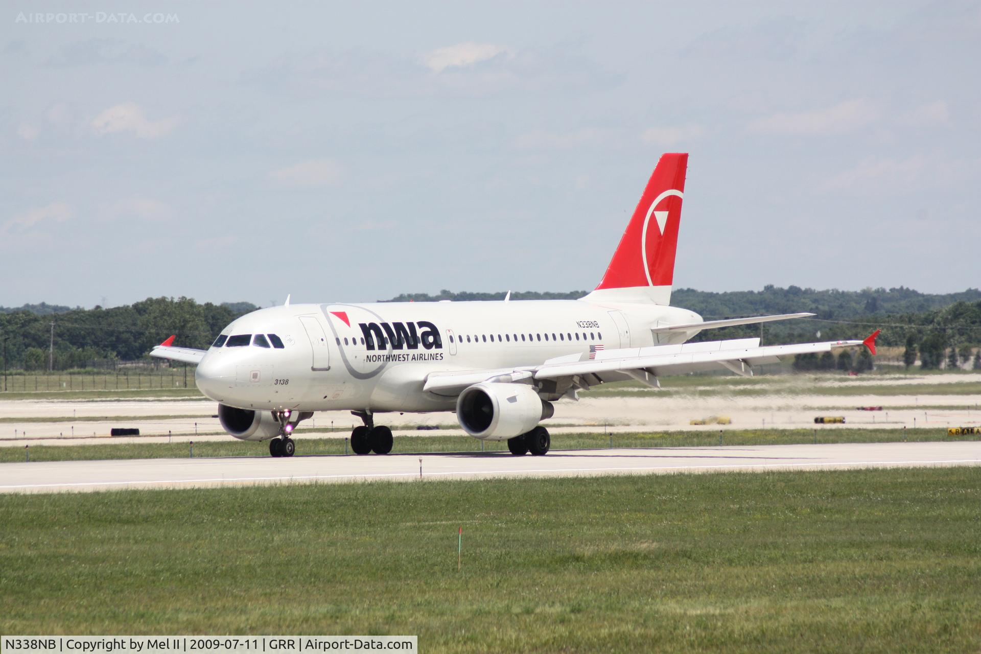 N338NB, 2002 Airbus A319-114 C/N 1693, NWA1240 - KDTW-KGRR - Landing RWY 26L