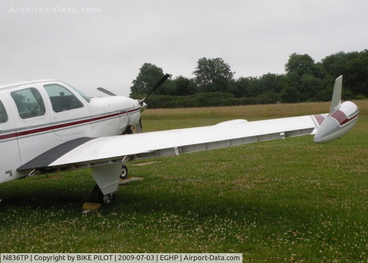 N836TP, 1984 Beech A36 Bonanza 36 C/N E=2124, CONTROL SURFACES DAMAGED AFTER A/C ROLLED BACKWARDS DOWN A SLOPE INTO A WOODEN SHED OVER NIGHT, A/C REPAIRABLE SHED W/O.