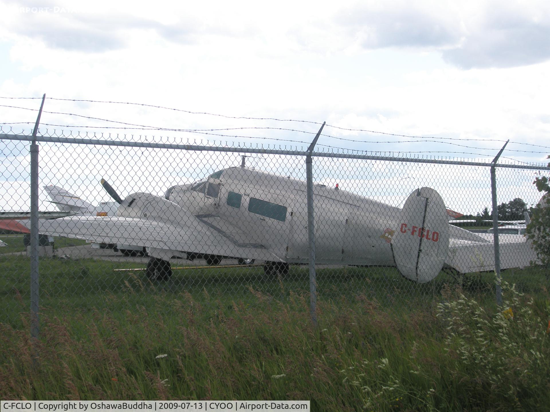 C-FCLO, 1956 Beech E18S-9700 C/N BA-143, Not a great shot - Parked in front of Enterprise Air Oshawa