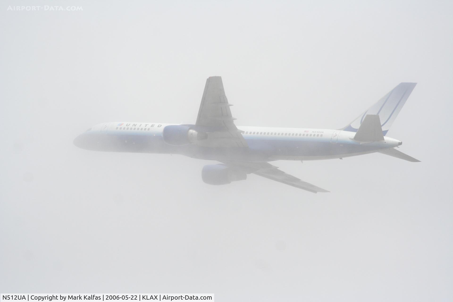 N512UA, 1990 Boeing 757-222 C/N 24809, United Airlines Boeing 757-222, N512UA departs KLAX RWY 25R into the soup..