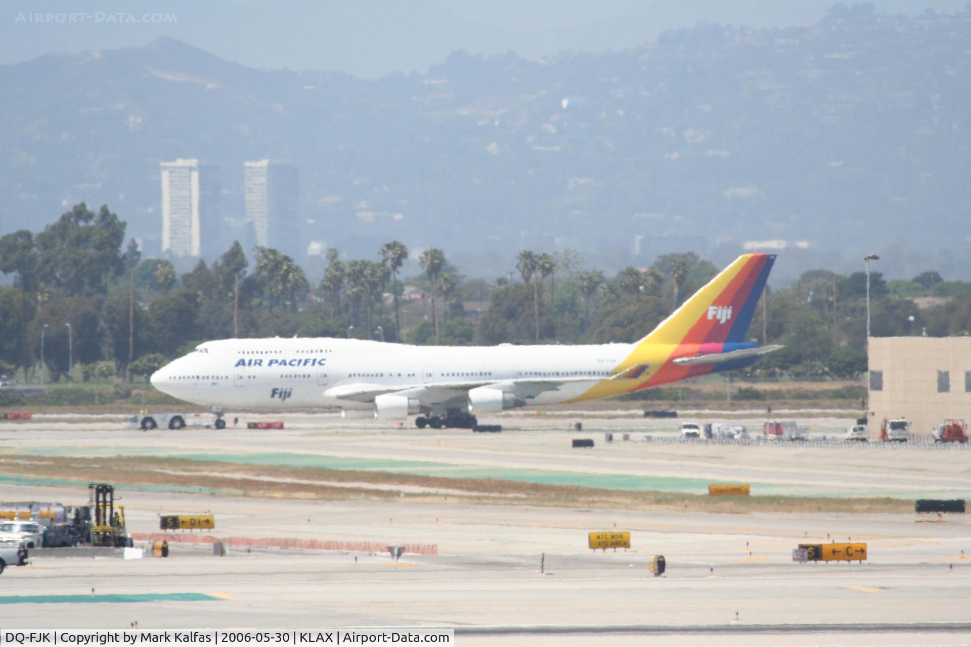 DQ-FJK, 1989 Boeing 747-412 C/N 24064, Air Pacific 747-412, DQ-FJK being towed to the gate - KLAX