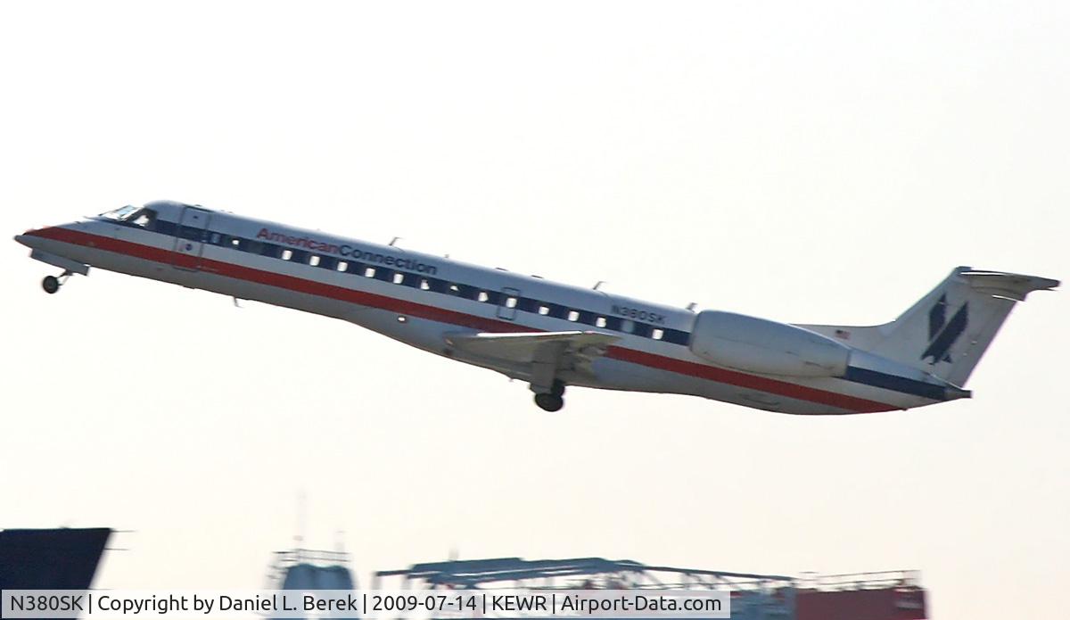 N380SK, 2002 Embraer ERJ-140LR (EMB-135KL) C/N 145613, Sleek regional jet launches into the early morning summer haze at Newark.