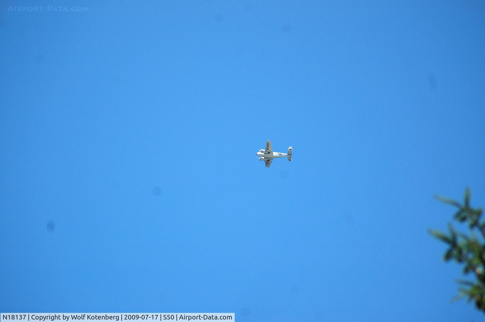 N18137, 1937 Lockheed 12A Electra Junior C/N 1229, nothing sneaks by this photographer making round engine noise