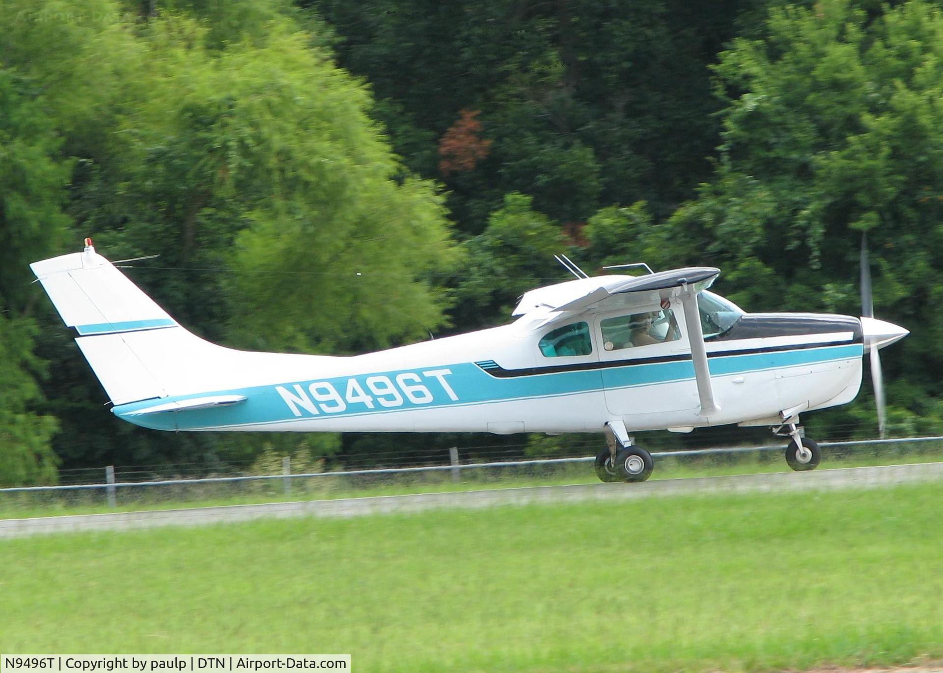 N9496T, 1960 Cessna 210 C/N 57296, Rolling for take off on runway 14 at the Shreveport Downtown airport.