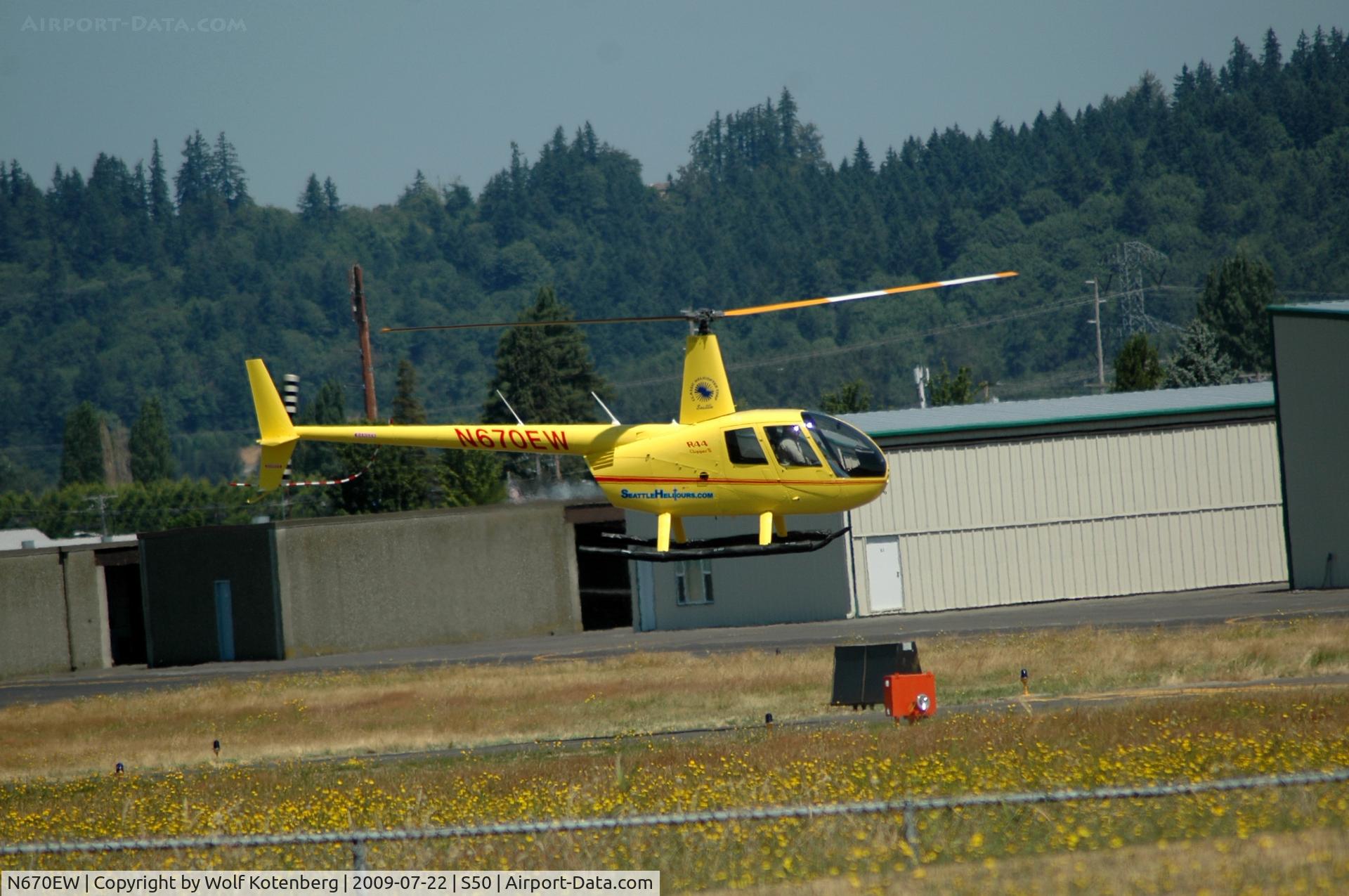 N670EW, Robinson R44 Raven II C/N 12849, hovering around