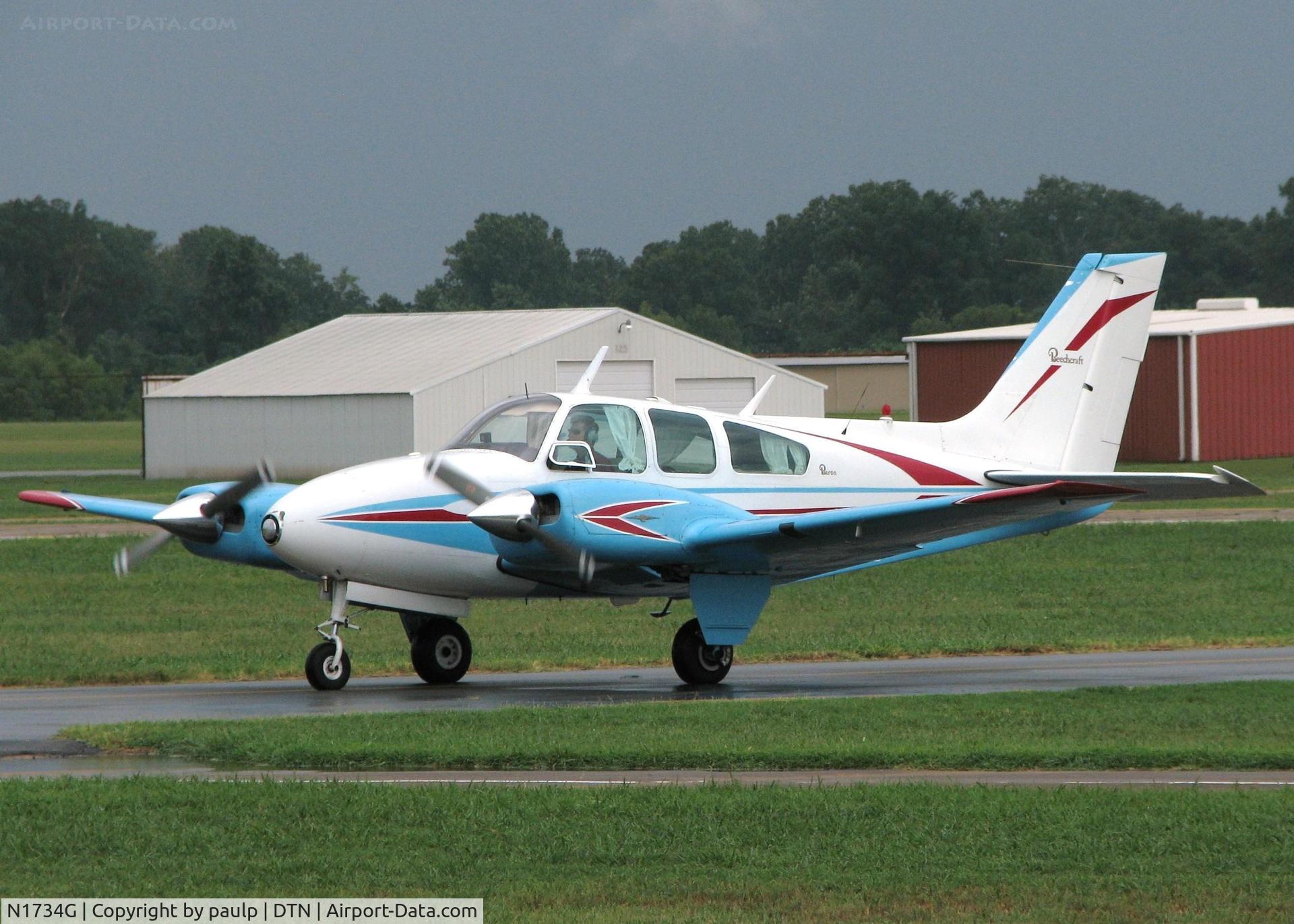 N1734G, 1962 Beech 95-A55 Baron C/N TC-275, Taxiing in after landing on runway 23 at the Shreveport Downtown airport. You can look at the sky in the background and see that this was not the most favorable conditions to be flying in, much less landing! Not sure what the gust were, but it wasn't a 