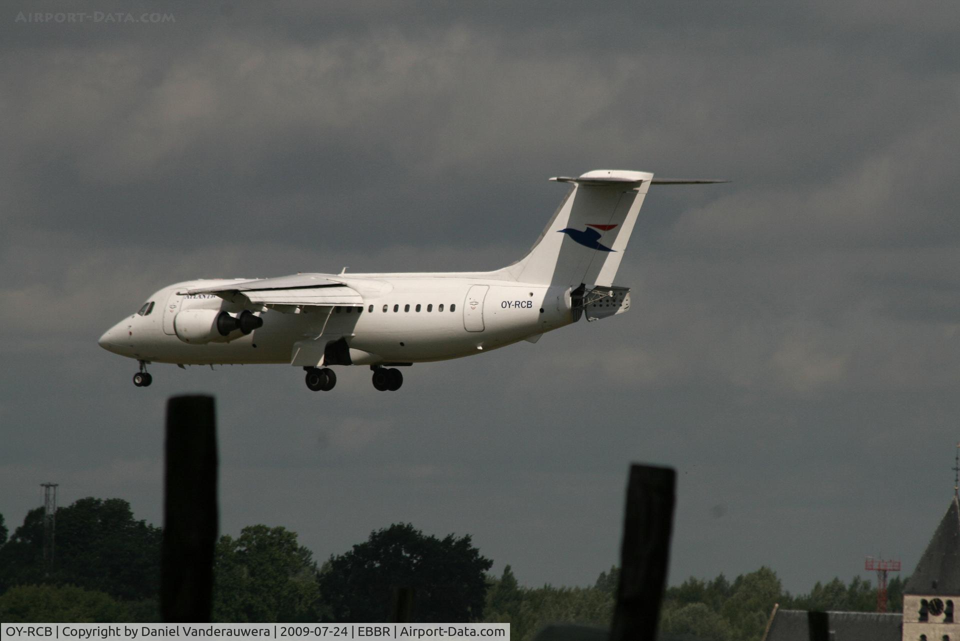OY-RCB, 1987 British Aerospace BAe.146-200 C/N E2094, flight RC7798 is descending to rwy 25L under a very cloudy sky