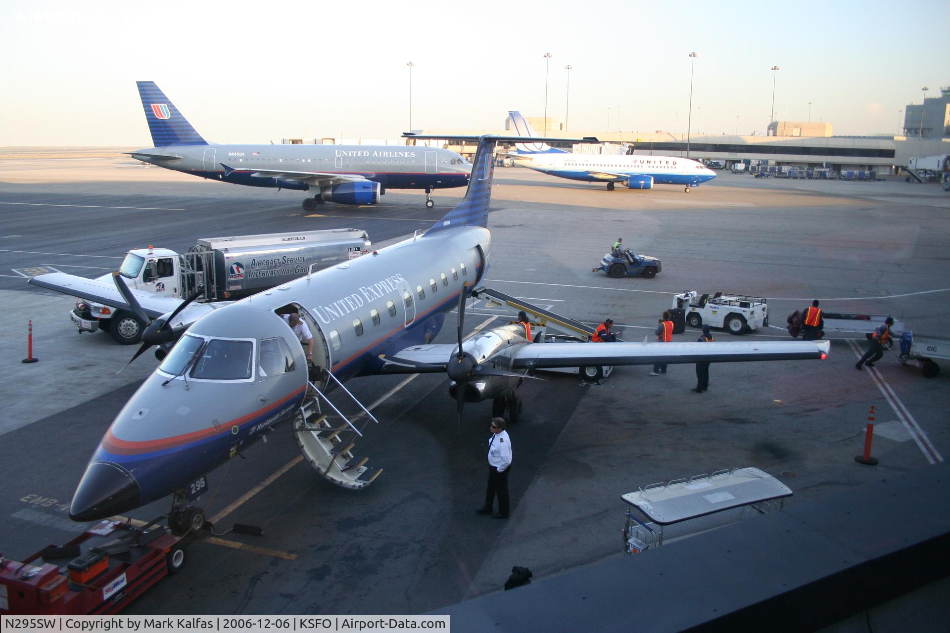 N295SW, 1996 Embraer EMB-120ER Brasilia C/N 120.322, SkyWest, (United Express) EMB-120ER, N295SW, at the gate KSFO with N485UA and N913UA in the backround.