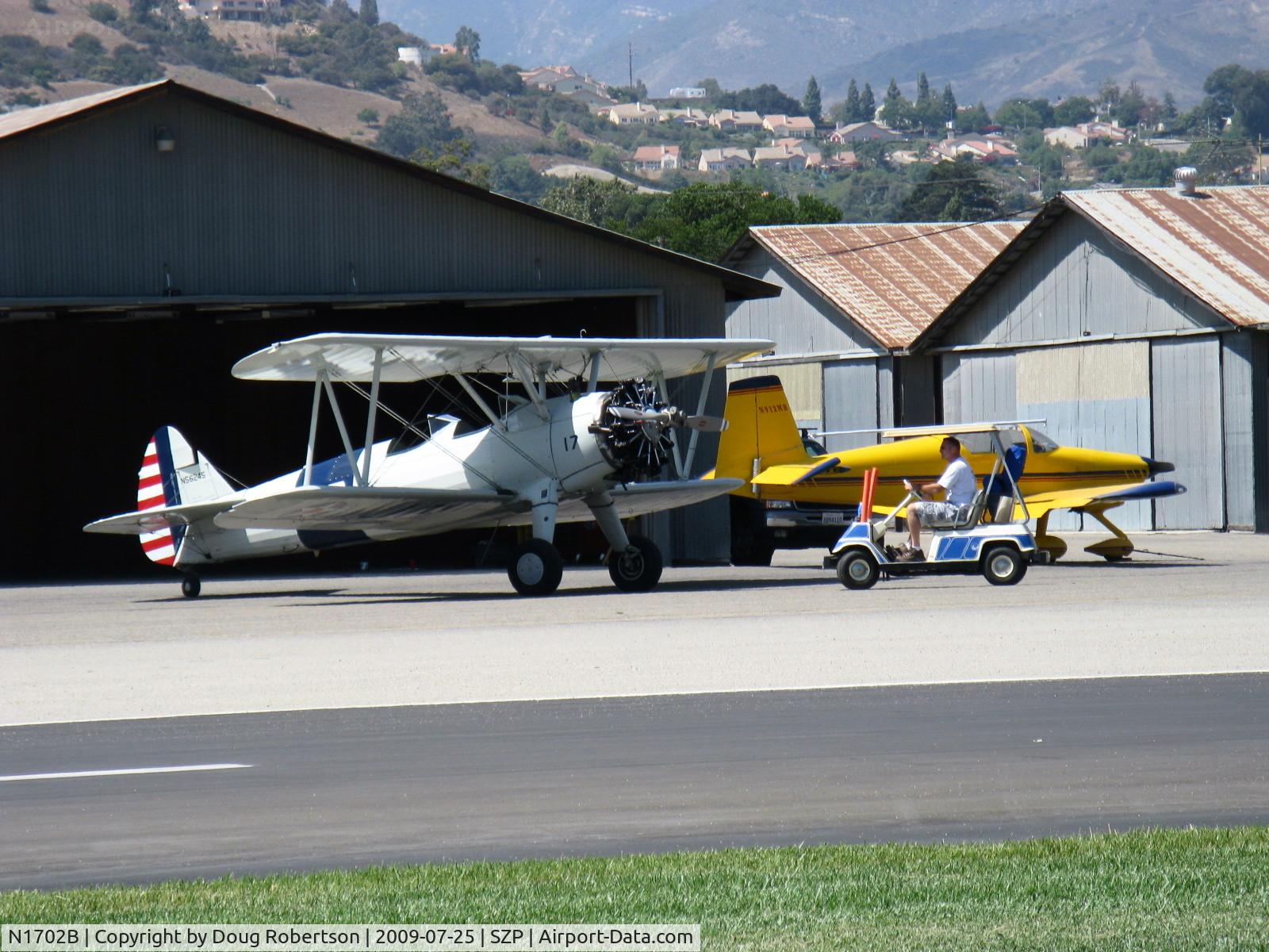 N1702B, 1942 Boeing PT-13D Kaydet (E75) C/N 75-5903, 1942 Boeing Stearman PT-13D 'Ruthie's Doll', Continental W670 220 Hp, being tugged out of hangar