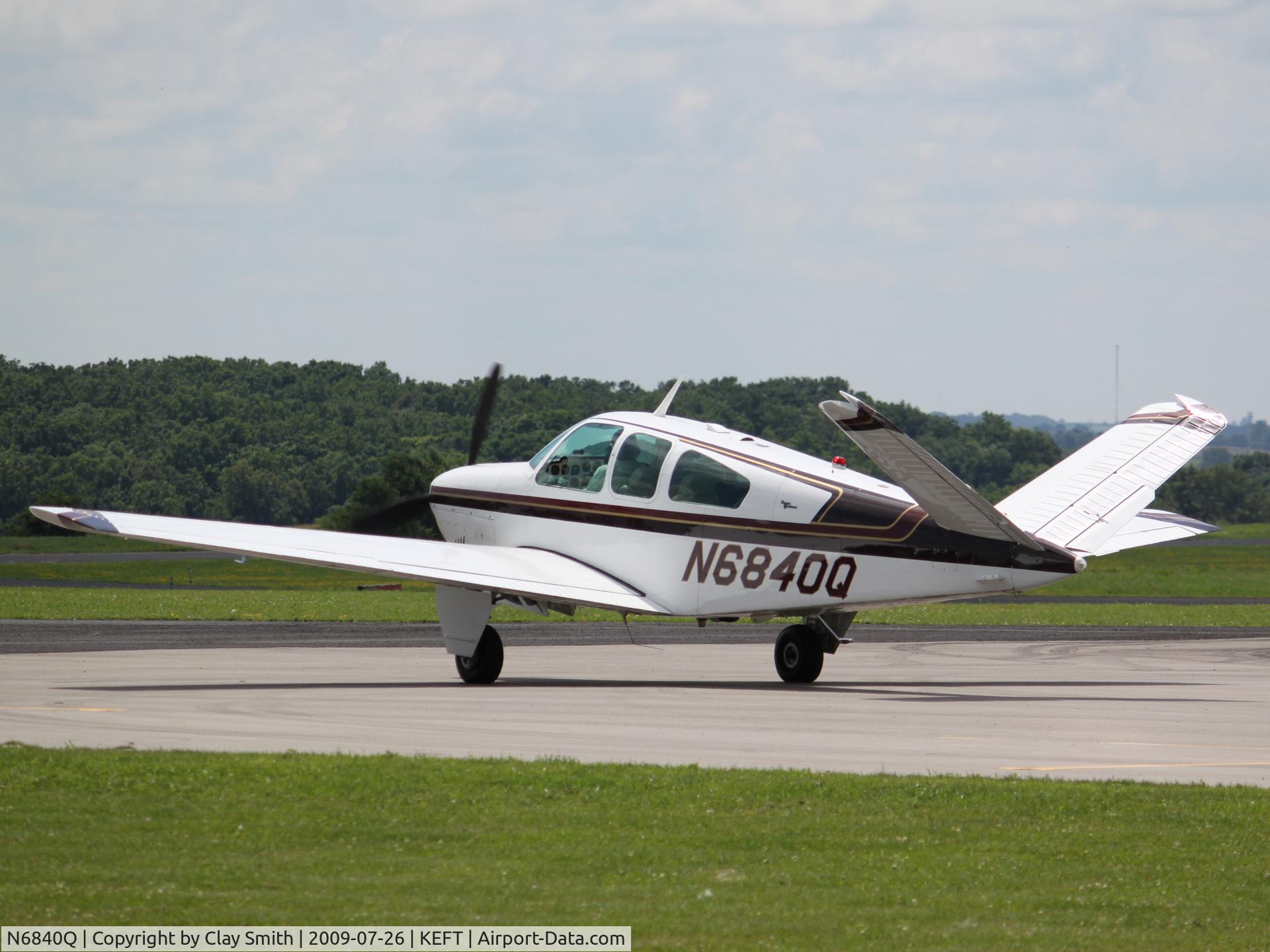N6840Q, 1964 Beech S35 Bonanza C/N D-7445, Taxing from the main ramp.