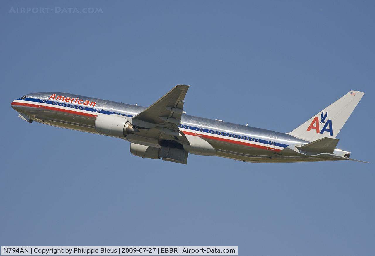 N794AN, 2000 Boeing 777-223 C/N 30256, Climbing from rwy 25R, bound to Chicago O'Hare. Gear up, but doors still open.