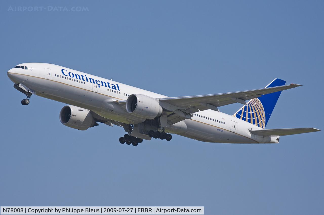 N78008, 1999 Boeing 777-224/ER C/N 29478, Off rwy 25R, runway heading. Gear moving up.