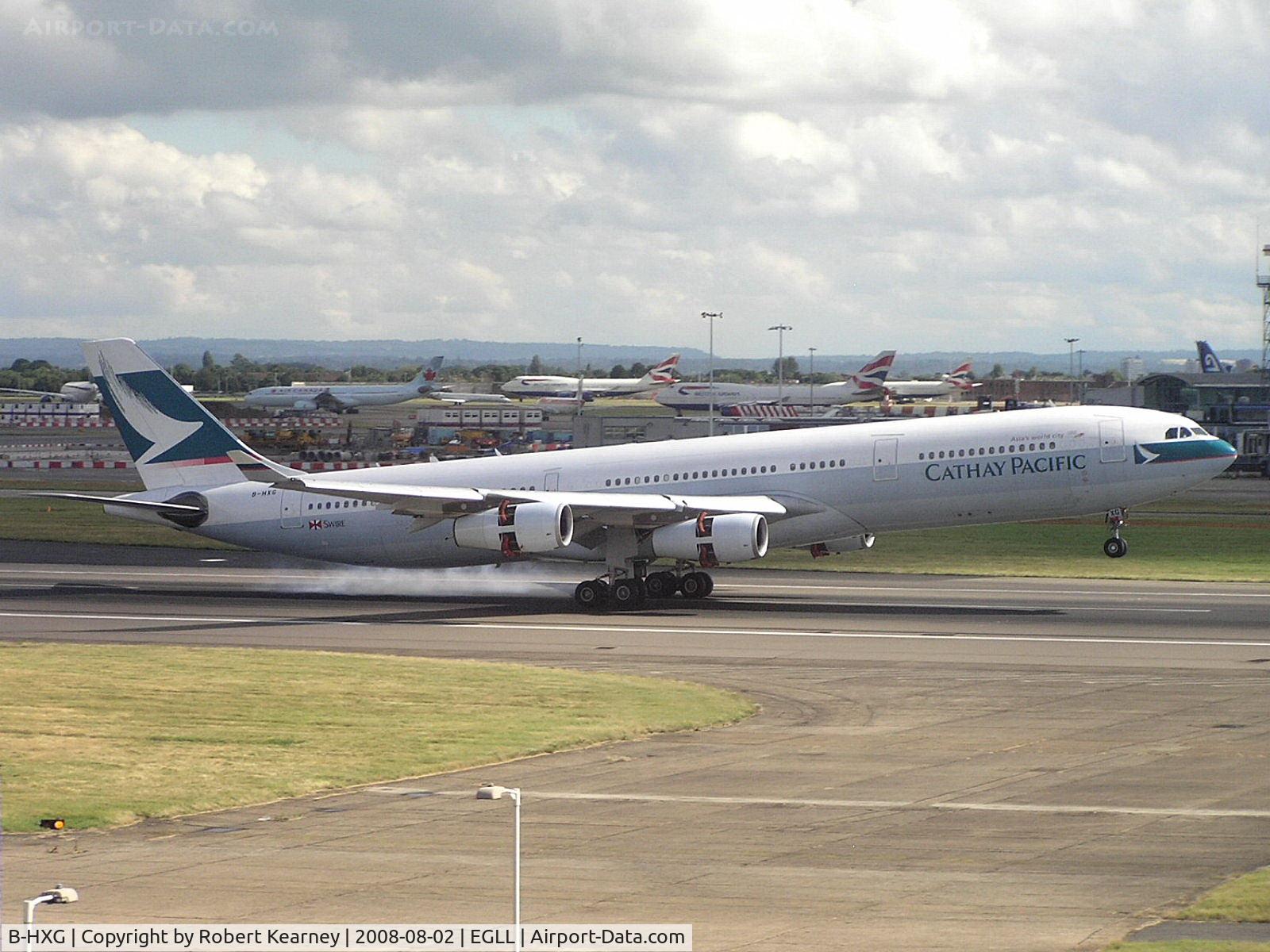 B-HXG, 1998 Airbus A340-313 C/N 208, Cathay just touching down
