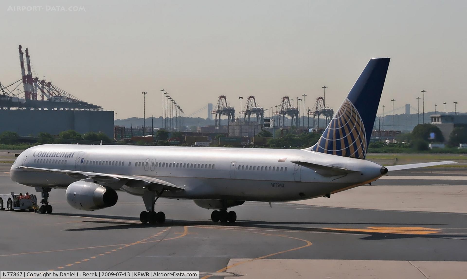 N77867, 2002 Boeing 757-33N C/N 32592, Being pushed back at Newark, in preparation for another voyage.