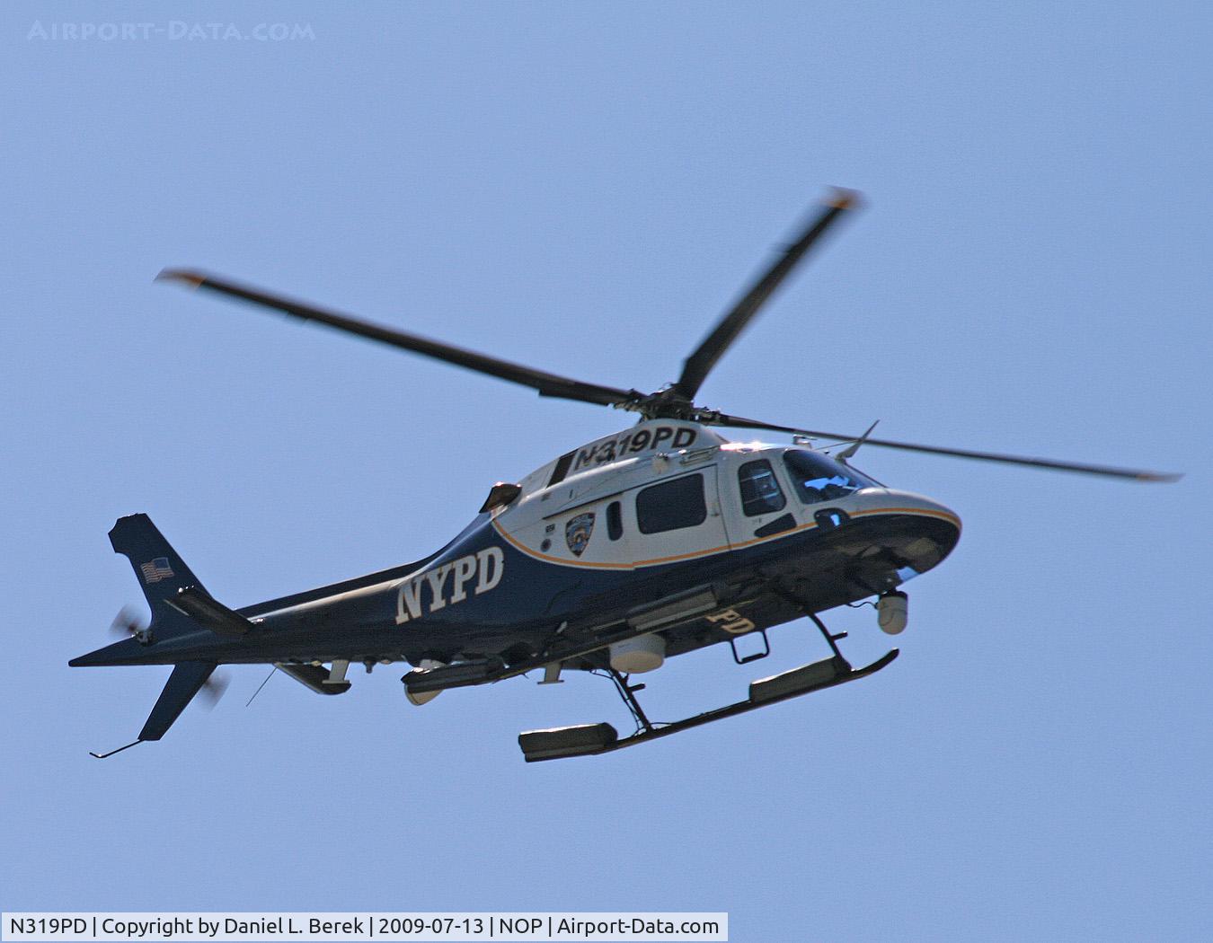 N319PD, 2004 Agusta A-119 Koala C/N 14040, One of New York's finest approaches the NYPD heliport base at Floyd Bennet Field (NOP).