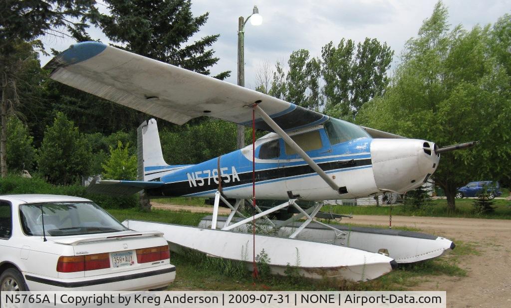 N5765A, 1956 Cessna 172 C/N 28365, 1956 Cessna 172 Skyhawk sitting in the parking lot at Anderson's Outpost in Carlos, MN.