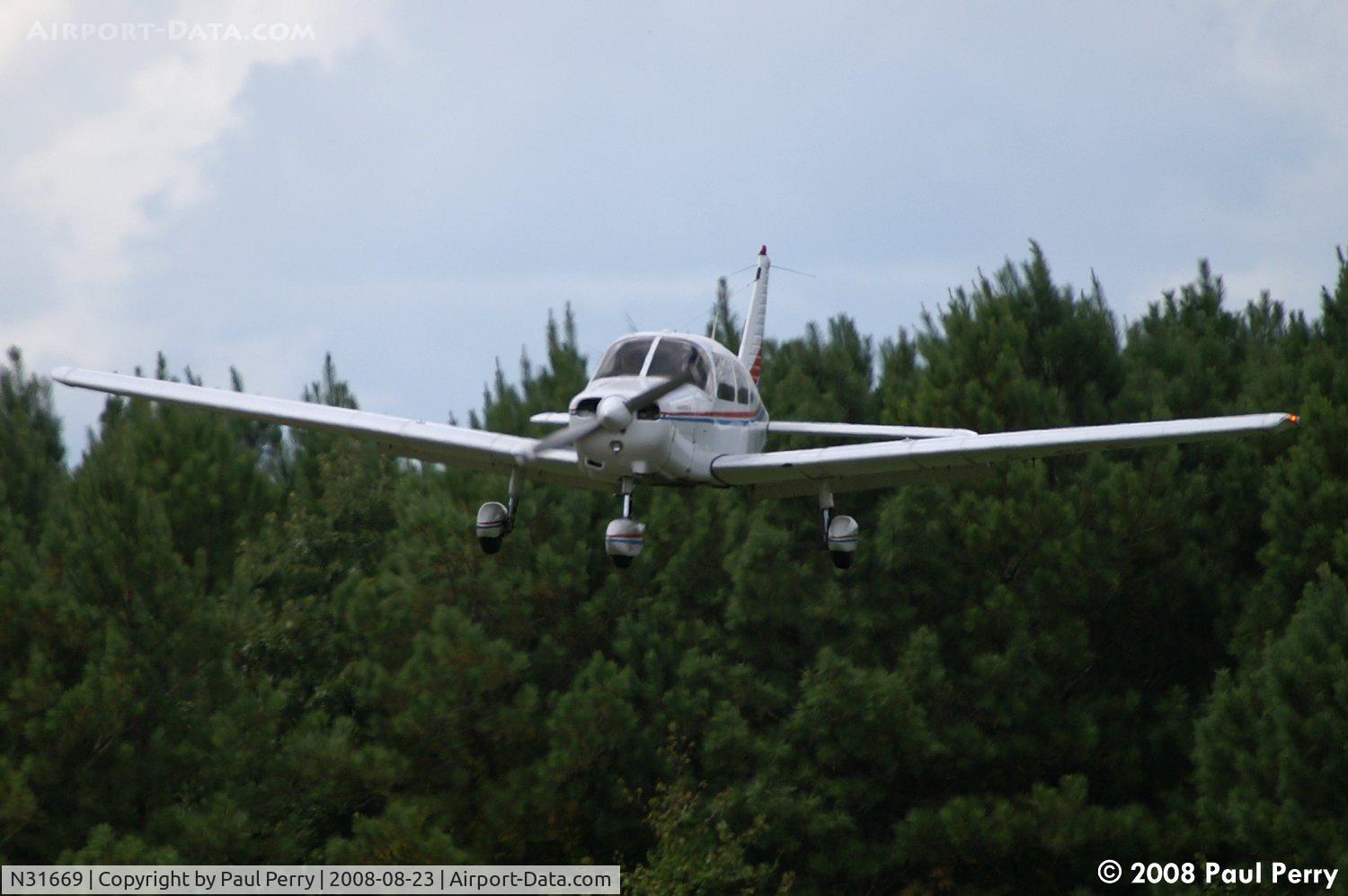 N31669, 1978 Piper PA-28-161 C/N 28-7816574, Letting down, between the corn