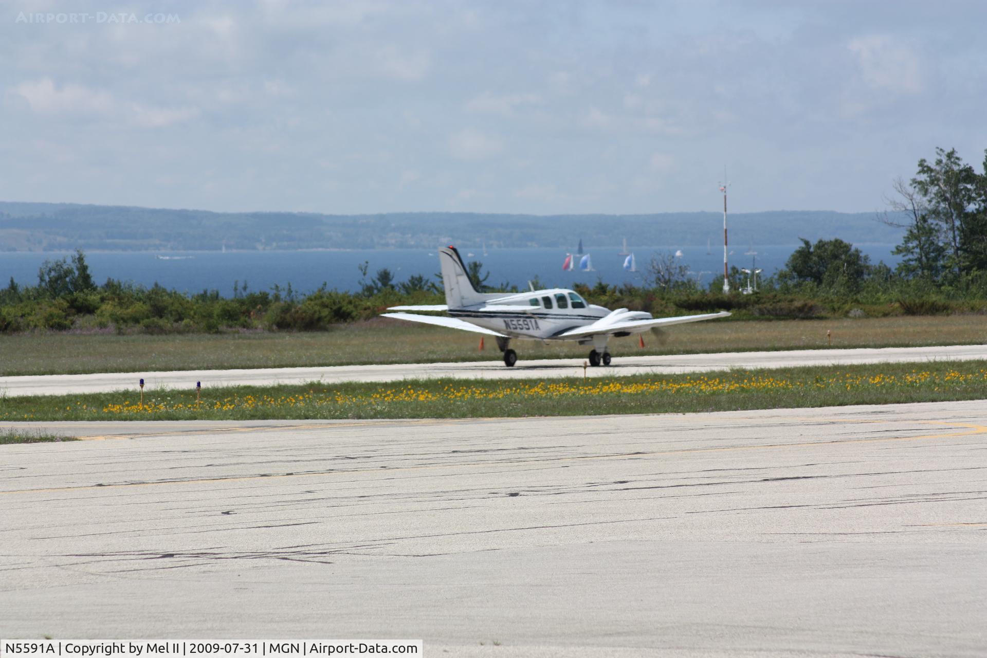 N5591A, 1989 Beech 58 Baron C/N TH-1566, KMGN-KTVC - Departing RWY 28