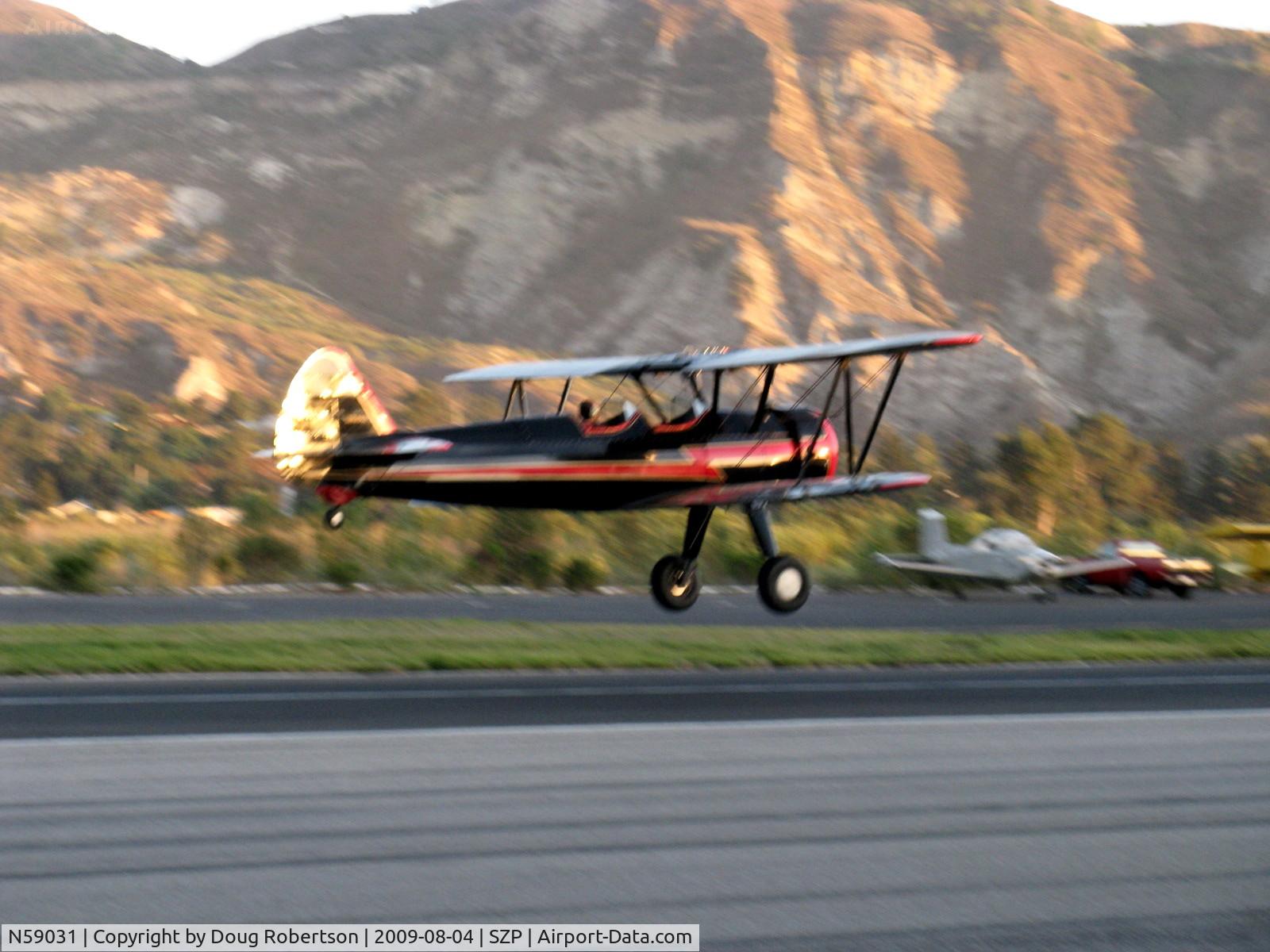 N59031, 1941 Boeing A75N1(PT17) C/N 75-3808, 1941 Boeing Stearman A75N1, Continental W670 220 Hp, early evening light-another takeoff climb Rwy 22