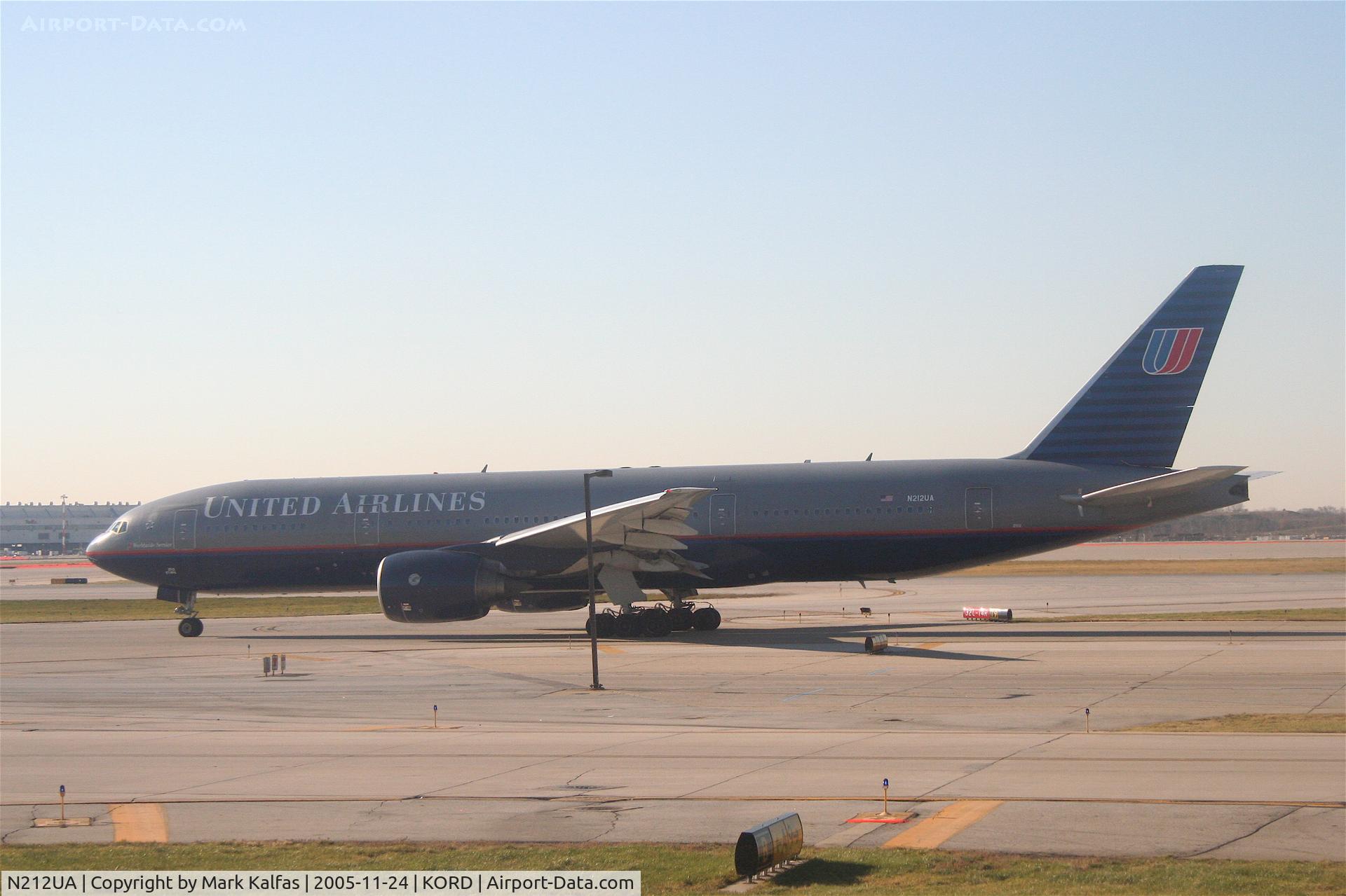 N212UA, 2000 Boeing 777-222 C/N 30218, United Airlines Boeing 777-222, N212UA Flight #1 taxiing to RWY 32R for a departure to HNL.
