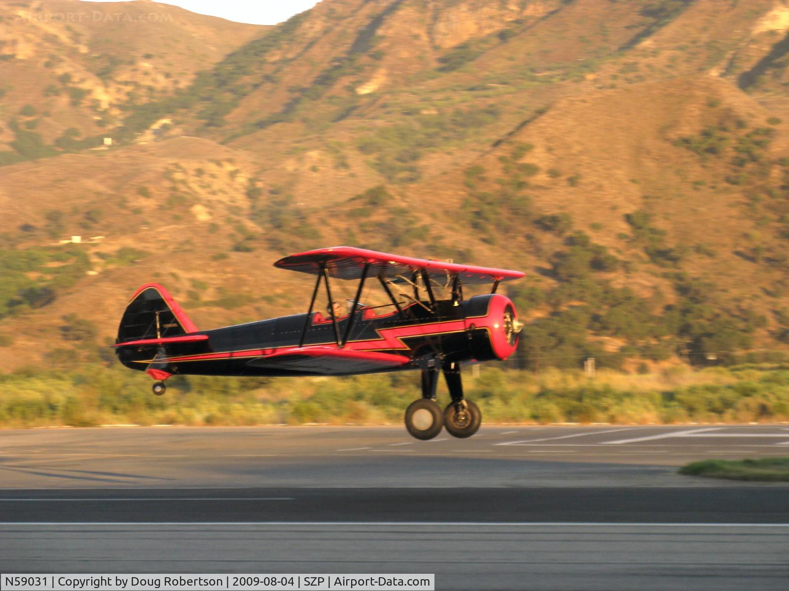 N59031, 1941 Boeing A75N1(PT17) C/N 75-3808, 1941 Boeing Stearman A75N1, Continental W670 220 Hp, early evening light-takeoff climb Rwy 22. Looks like I need to spend more time on the productive night shift, lol.