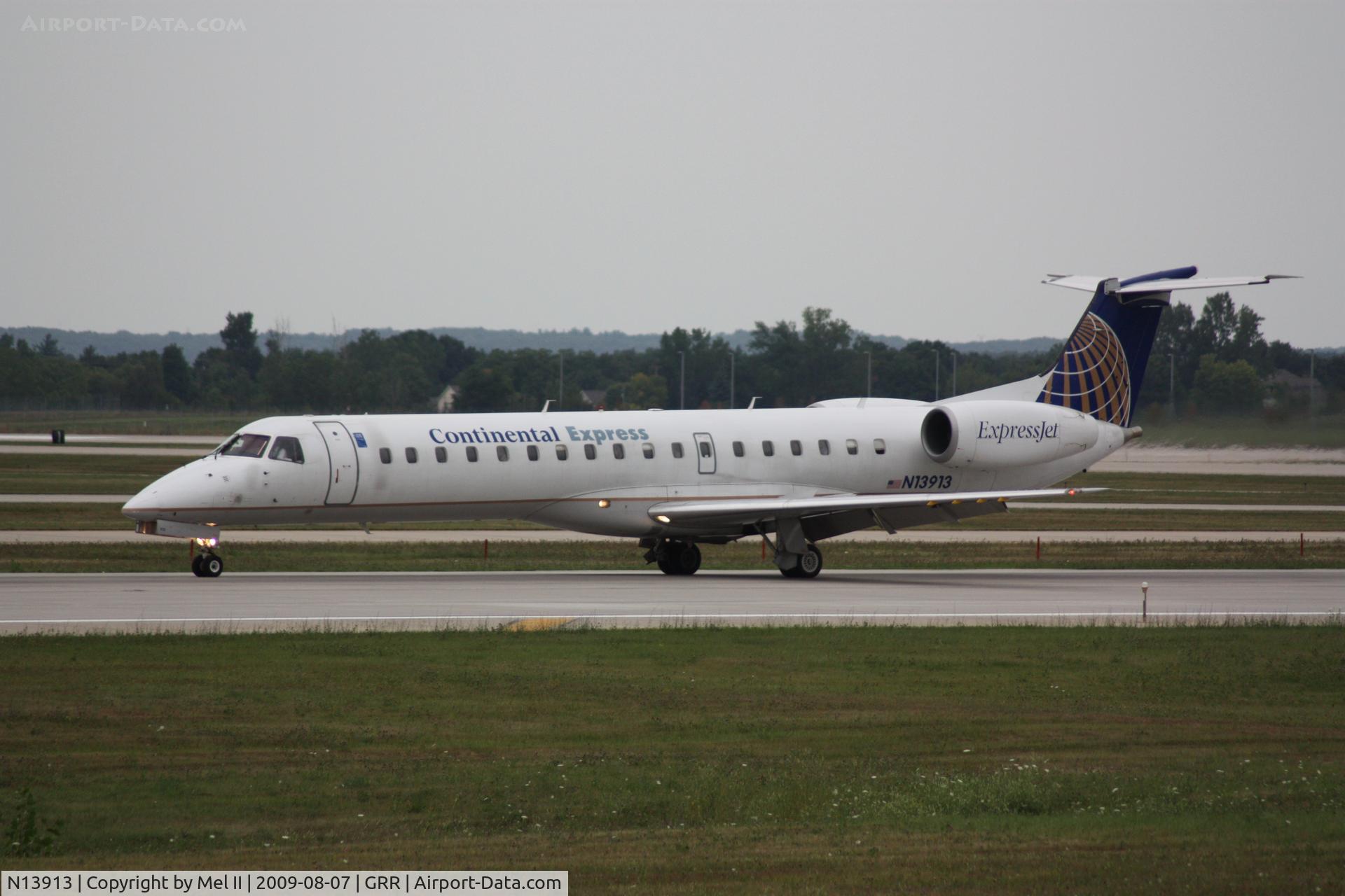 N13913, 2001 Embraer ERJ-145LR (EMB-145LR) C/N 145438, BTA3037 - KCLE-KGRR - Landing RWY 26L