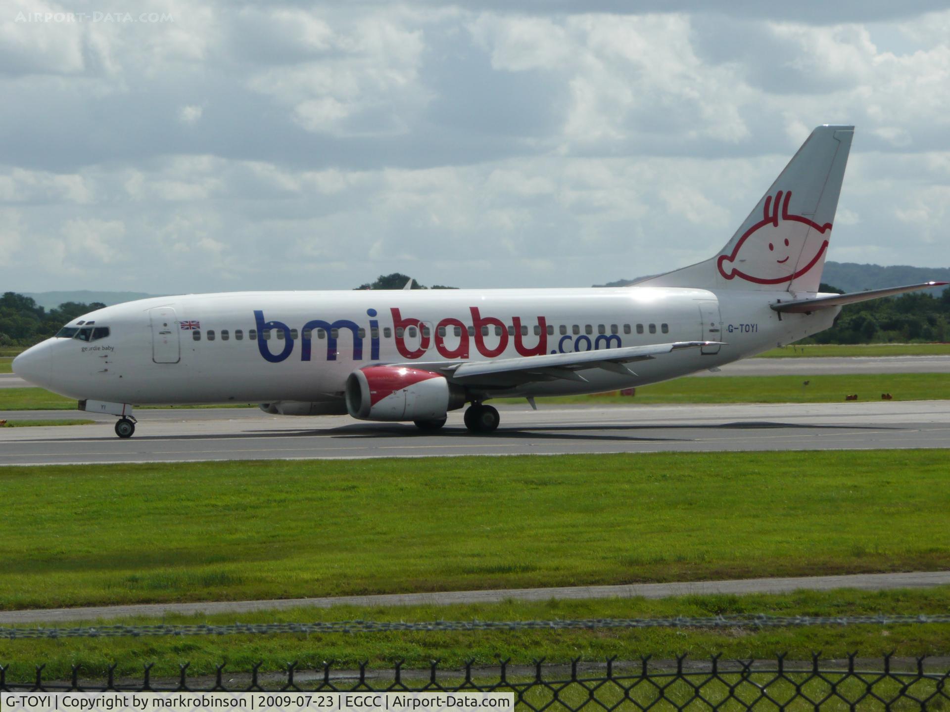G-TOYI, 1998 Boeing 737-3Q8 C/N 28054, aircraft seen taxing off runway 23R.