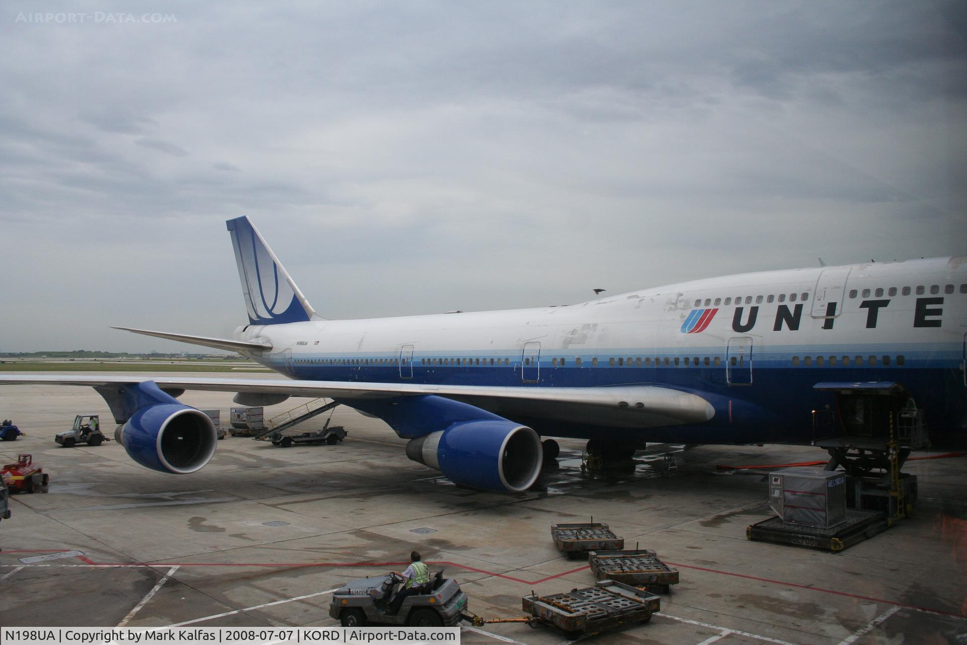 N198UA, 1997 Boeing 747-422 C/N 28716, United Airlines Boeing 747-422, N198UA at KORD gate C18 loading up for a trip to ZBAA