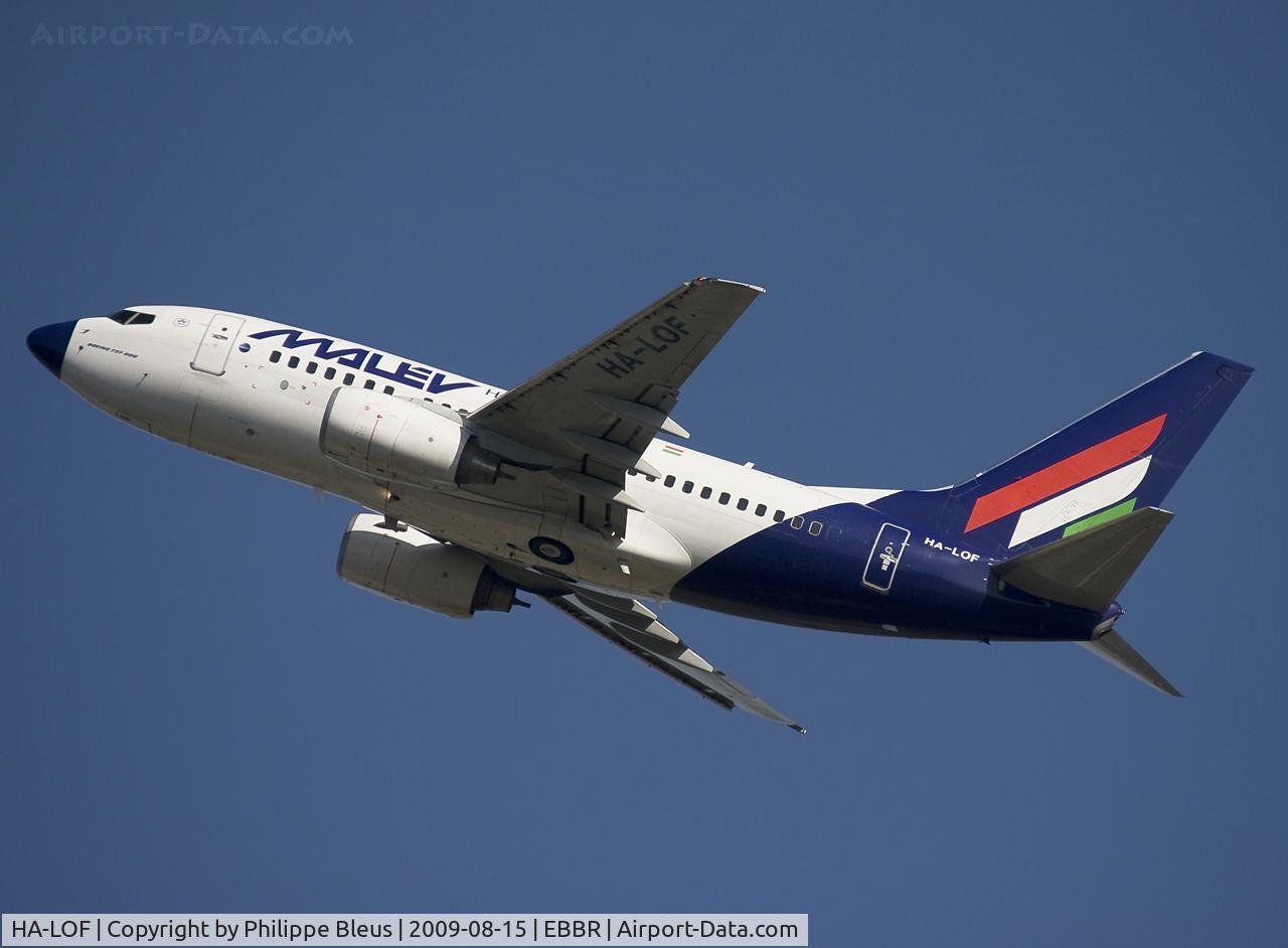 HA-LOF, 2003 Boeing 737-6Q8 C/N 29348, Rising from rwy 25R. Gear back up.
