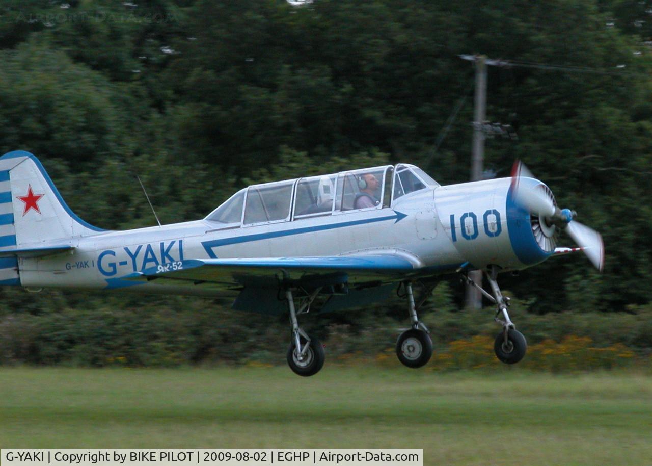 G-YAKI, 1986 Bacau Yak-52 C/N 866904, ABOUT TO TOUCH DOWN ON 26